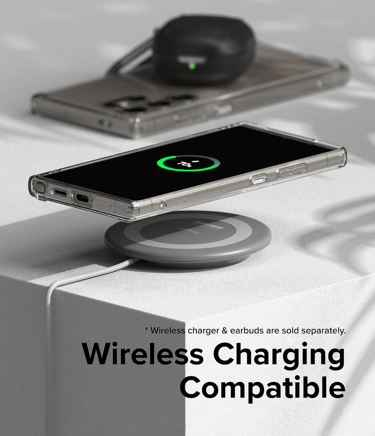 Galaxy S24 Ultra Case | Fusion - Clear phone case on a wireless charging pad showing a 70% charge icon on the screen.