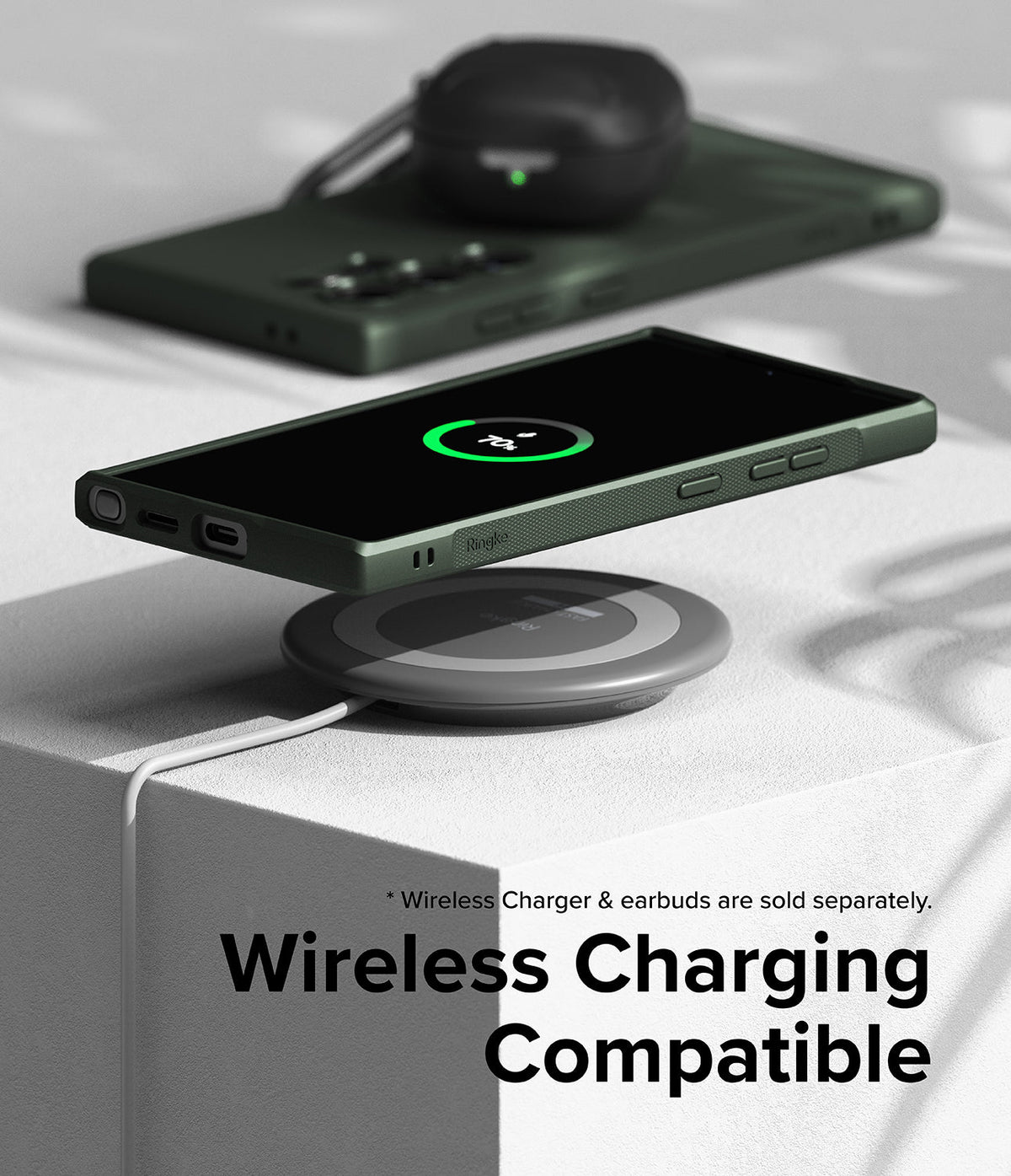 Galaxy S24 Ultra Case | Onyx - Dark green phone case on a wireless charging pad showing a 70% charge icon on the screen.