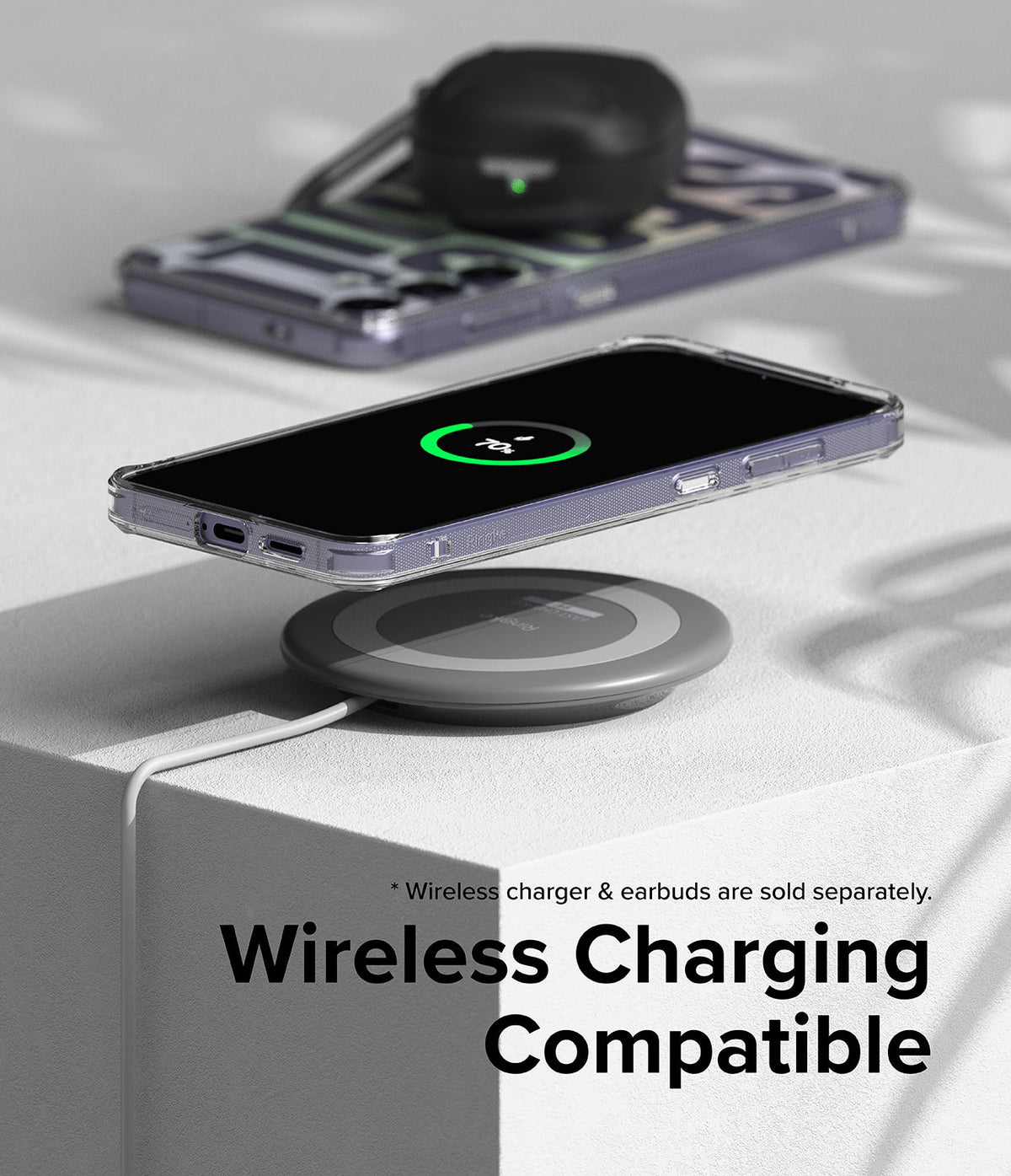 Galaxy S24 Plus Case | Fusion Design - A Galaxy S24 Plus in a clear case wirelessly charging on a circular pad.