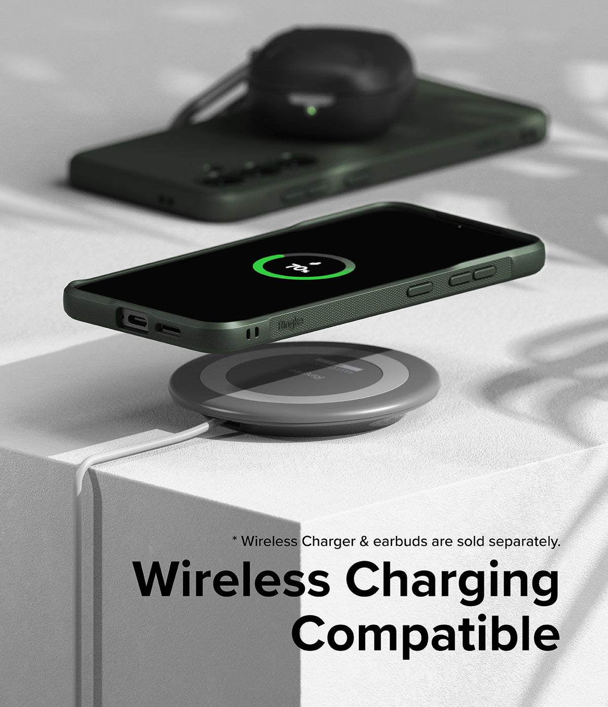 Galaxy S24 Plus Case | Onyx - Dark green phone case on a wireless charging pad showing a 70% battery charge icon.