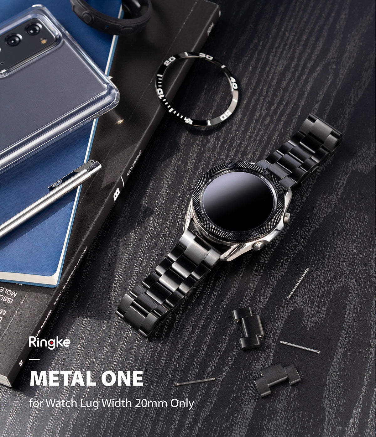 Watch Lug 20mm | Metal One Band - Black metal watch band attached to a smartwatch on a dark desk with spare links and pins.