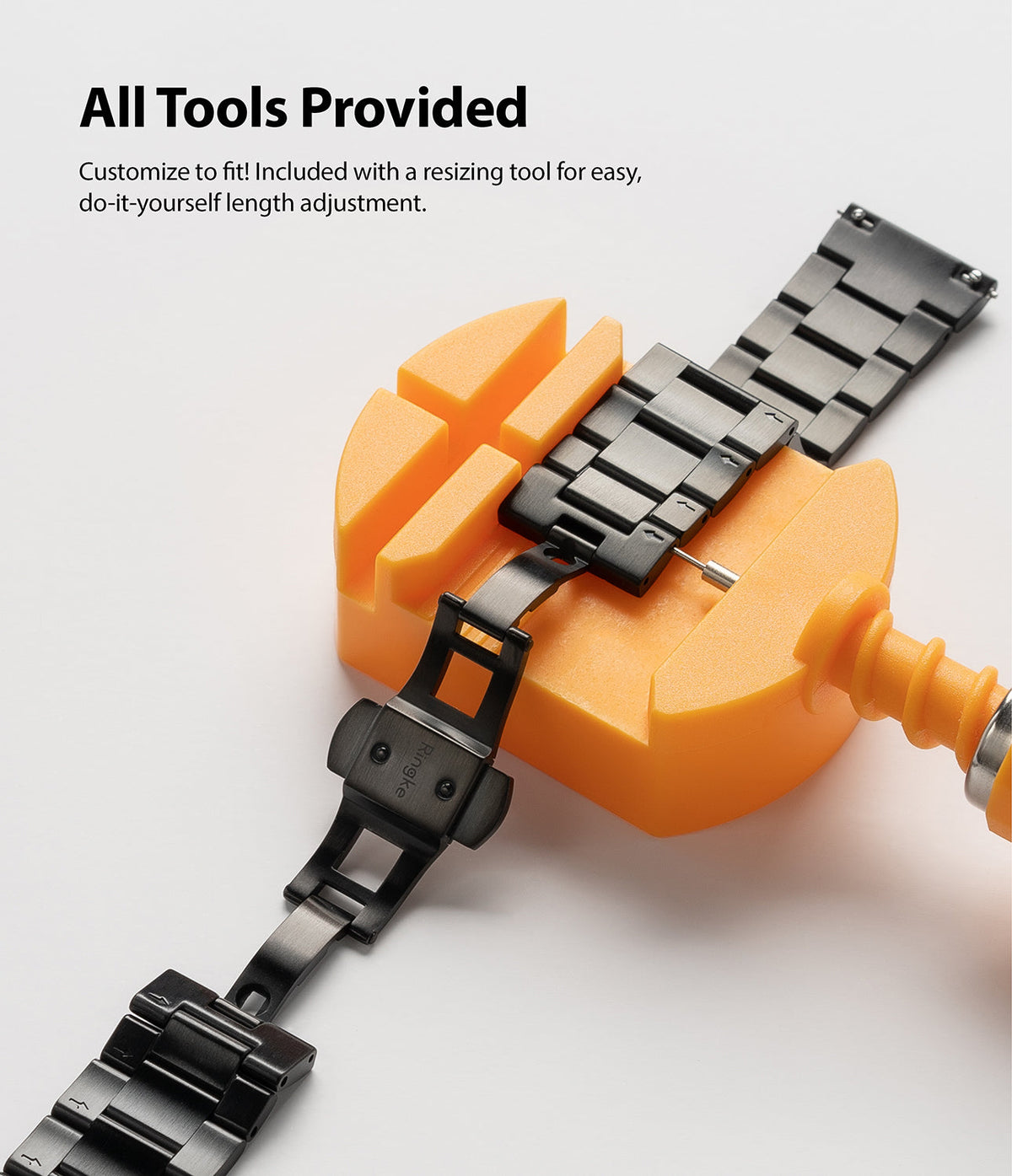 Watch Lug 20mm | Metal One Band - Black metal watch band being resized in an orange plastic tool on a white background.