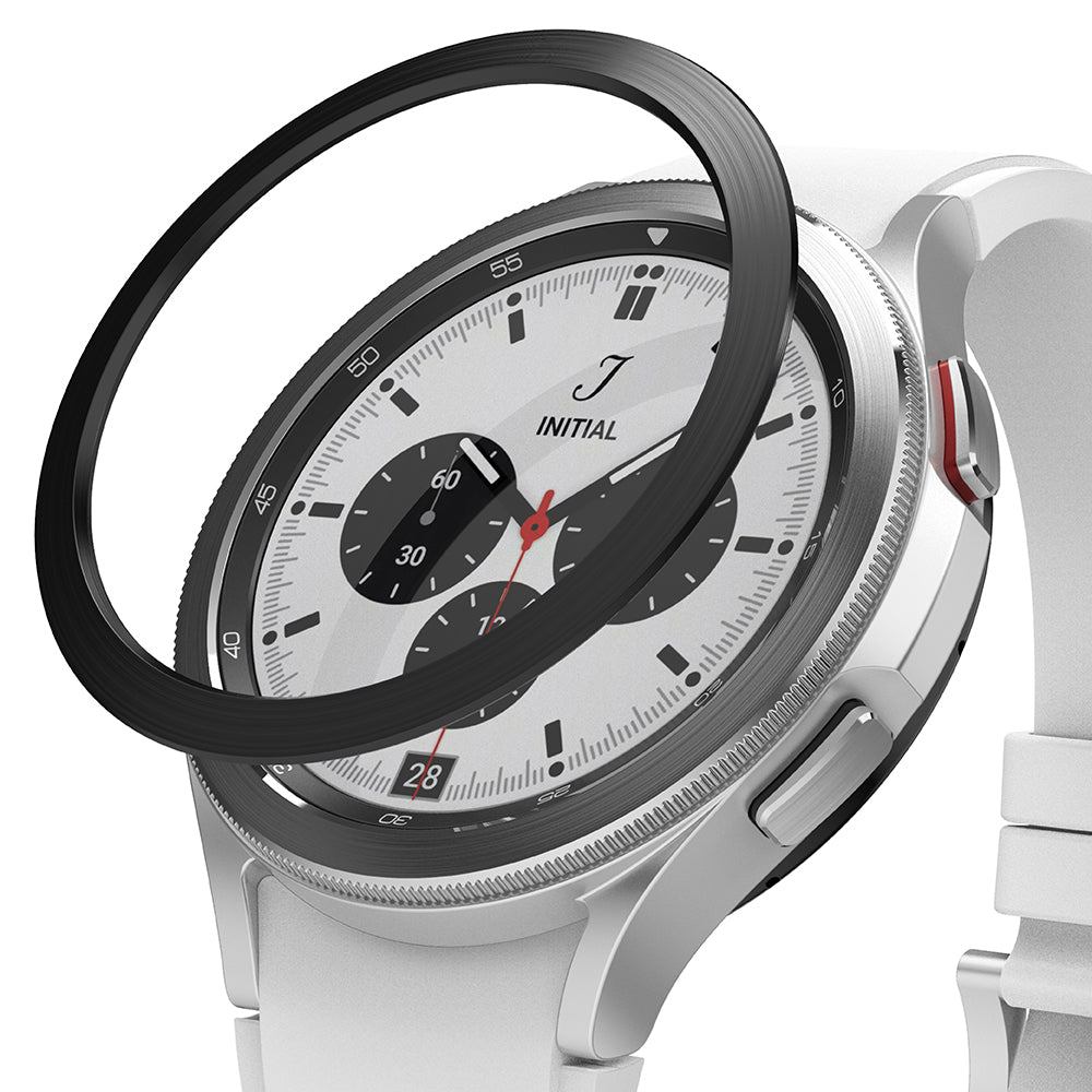 Galaxy Watch 4 Classic 42mm | Bezel Styling - A black adhesive bezel ring hovering above a silver smartwatch face.