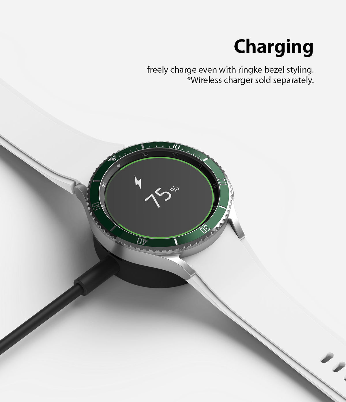 Galaxy Watch 4 Classic 42mm | Bezel Styling - A silver smartwatch with a green bezel ring charging on a wireless dock.