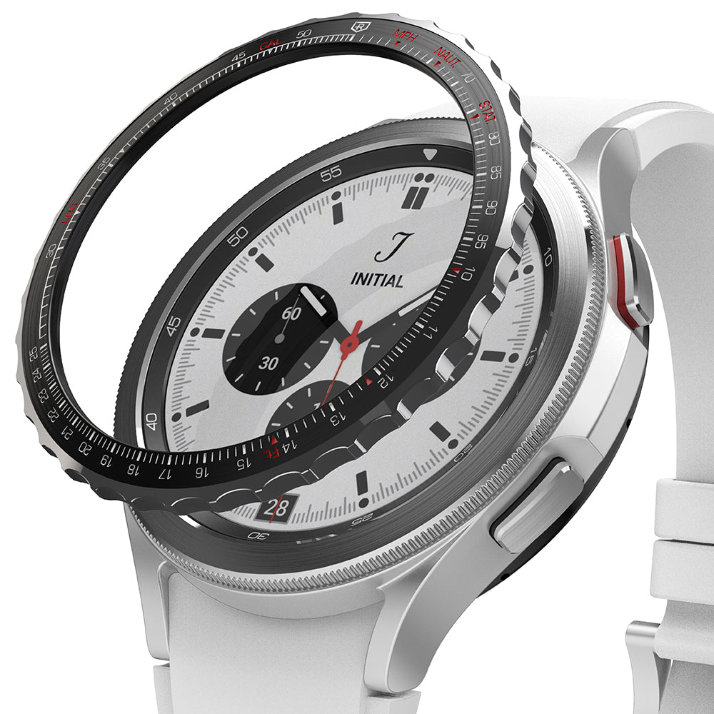 Galaxy Watch 4 Classic 42mm | Bezel Styling - Galaxy Watch 4 Classic 42mm - Black tachymeter bezel styling hovering above a silver smartwatch with a white strap.
