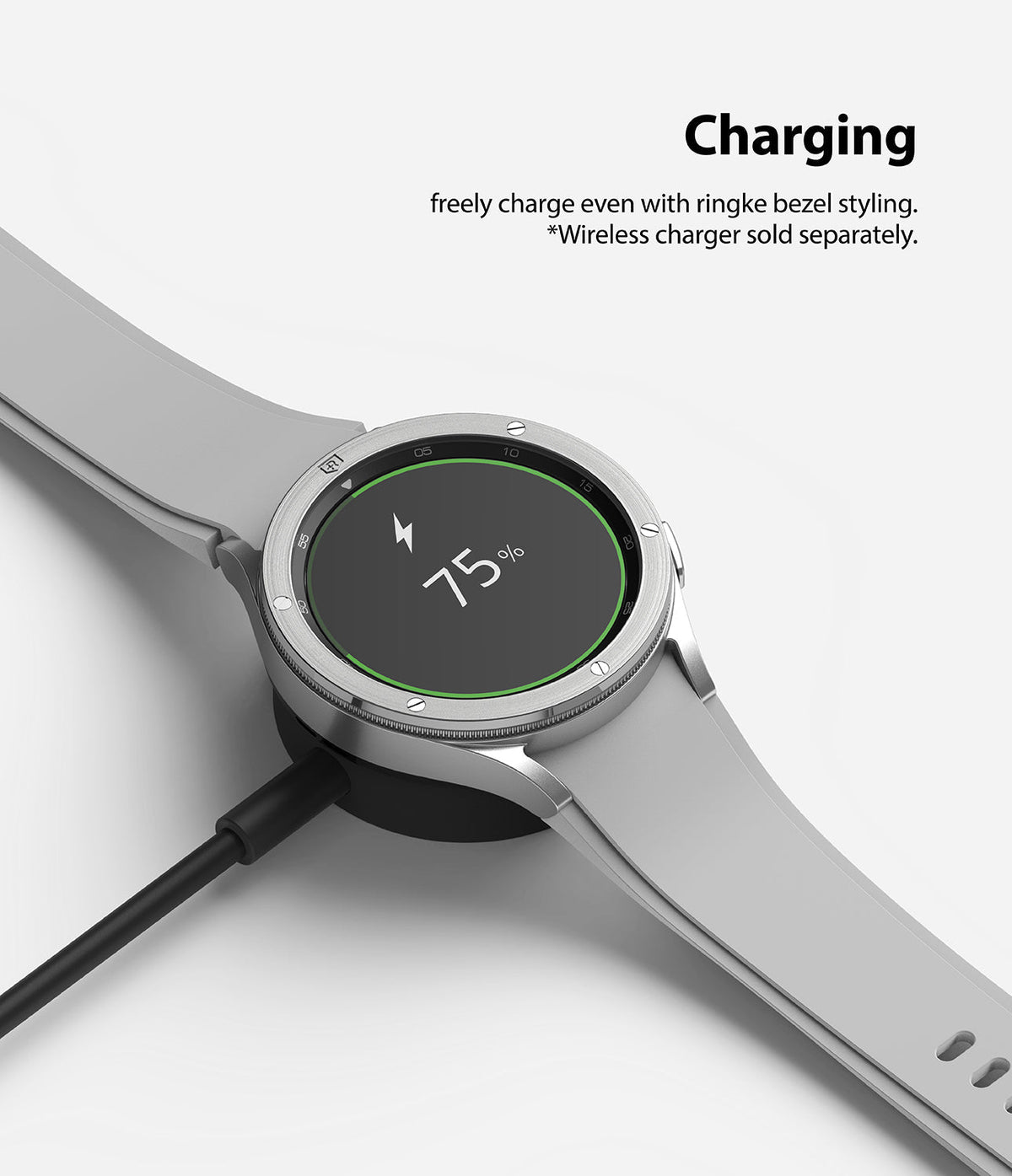 Galaxy Watch 4 Classic 46mm | Bezel Styling - Silver smartwatch with bezel styling charging on a wireless dock.