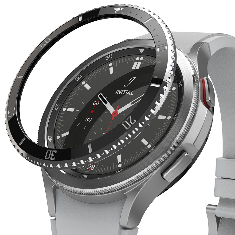 Galaxy Watch 4 Classic 46mm | Bezel Styling - A black adhesive bezel ring hovering above a silver smartwatch face.