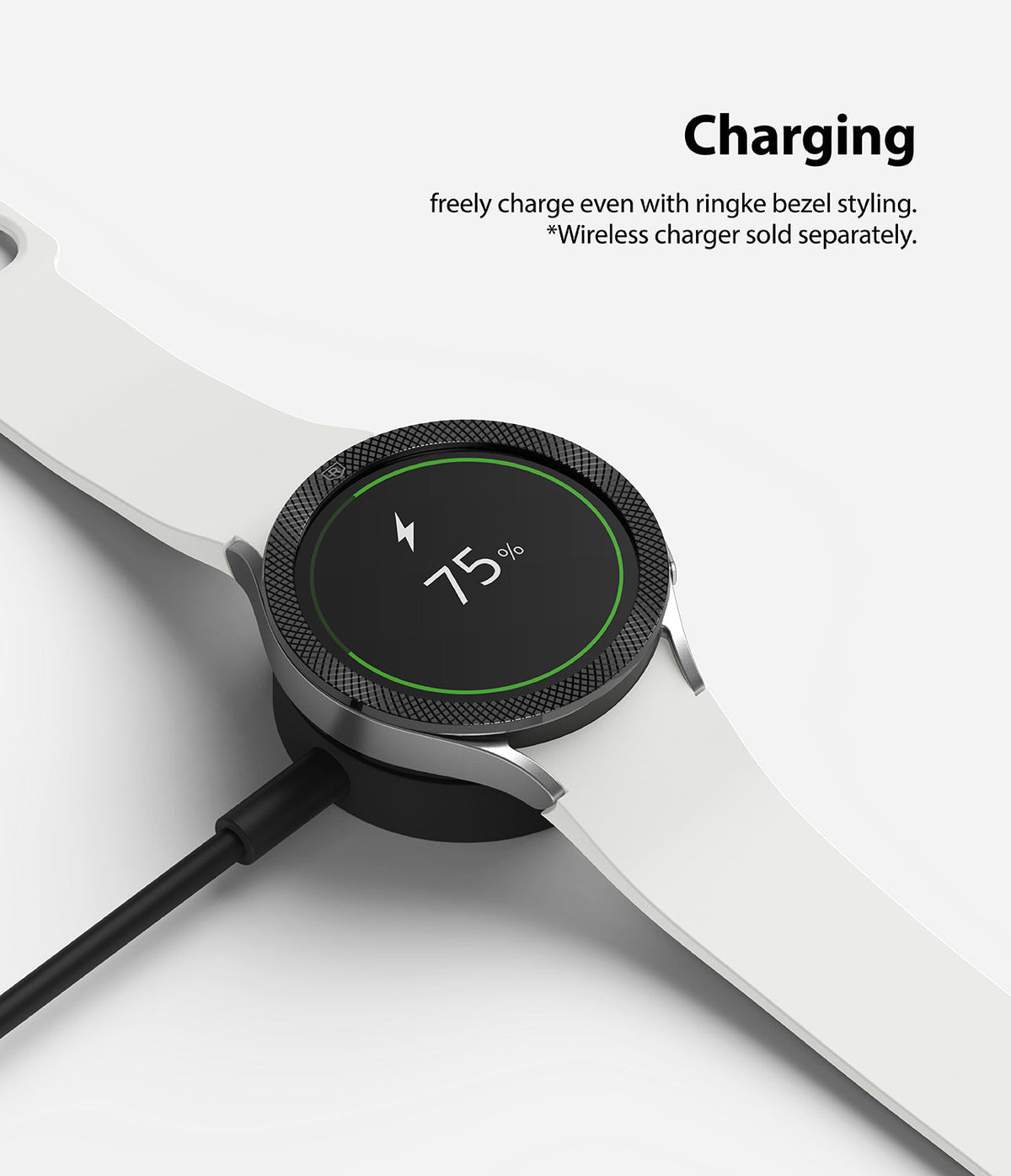 Galaxy Watch 5 / 4 (40mm) | Bezel Premium Styling - Smartwatch with textured black bezel charging on a wireless dock.