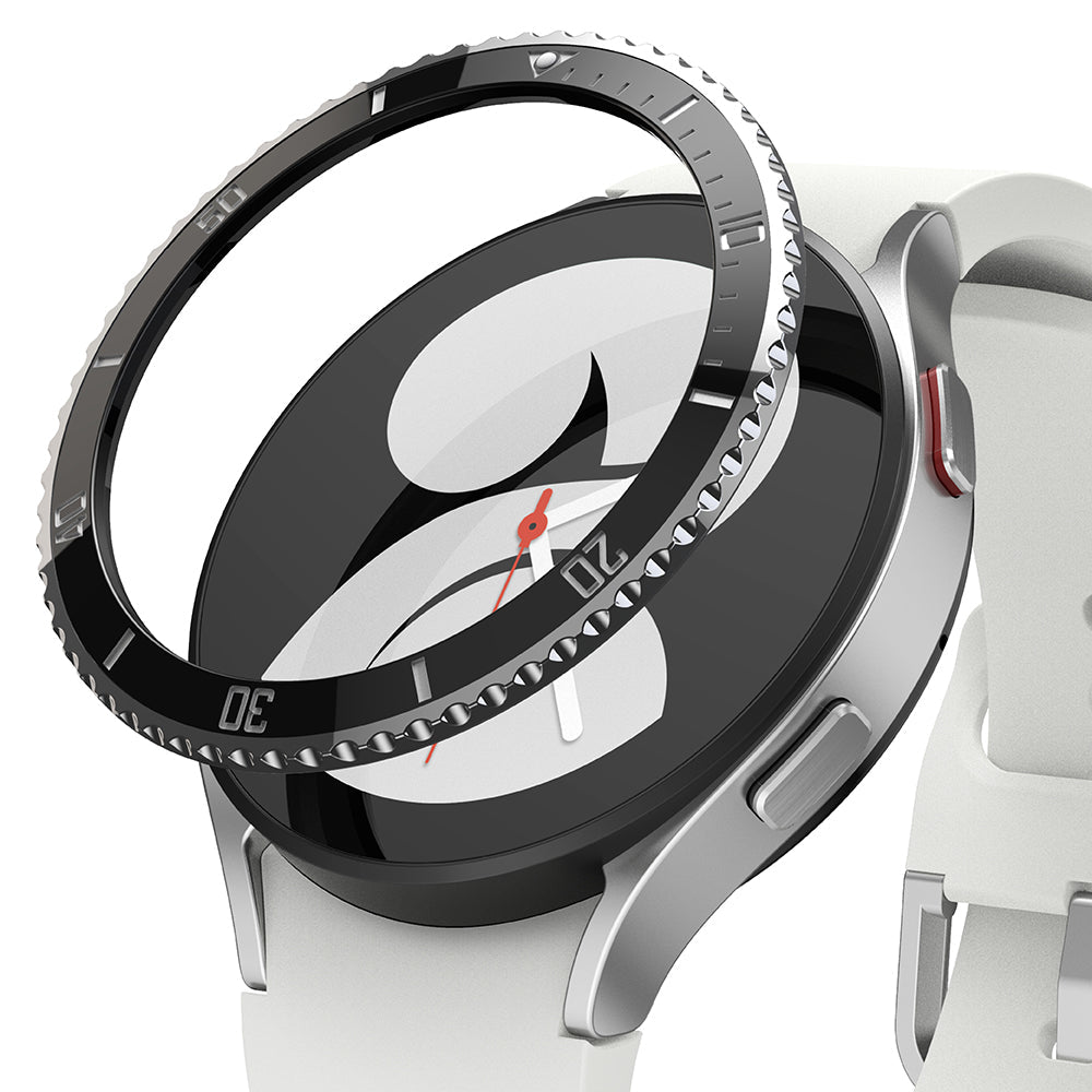 Galaxy Watch 5 / 4 (40mm) | Bezel Premium Styling - Black adhesive bezel ring hovering above a silver Galaxy Watch.