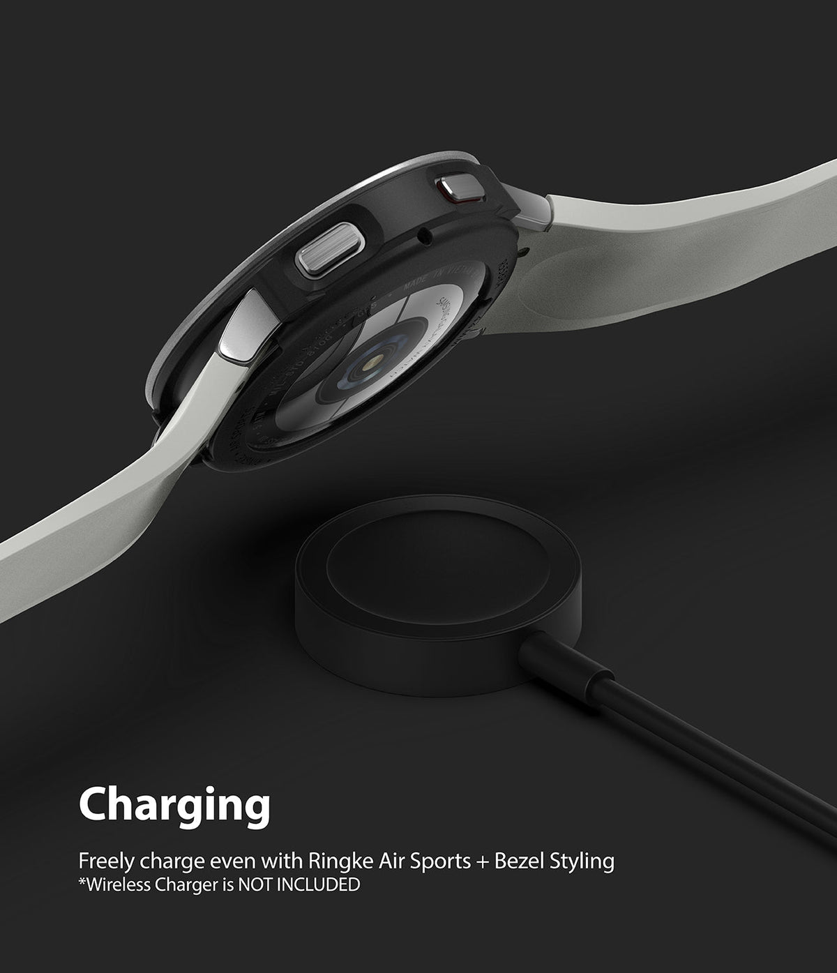 Galaxy Watch 4 44mm | Air Sports Black + Bezel Styling - Watch with protective case and bezel hovering over a charger.