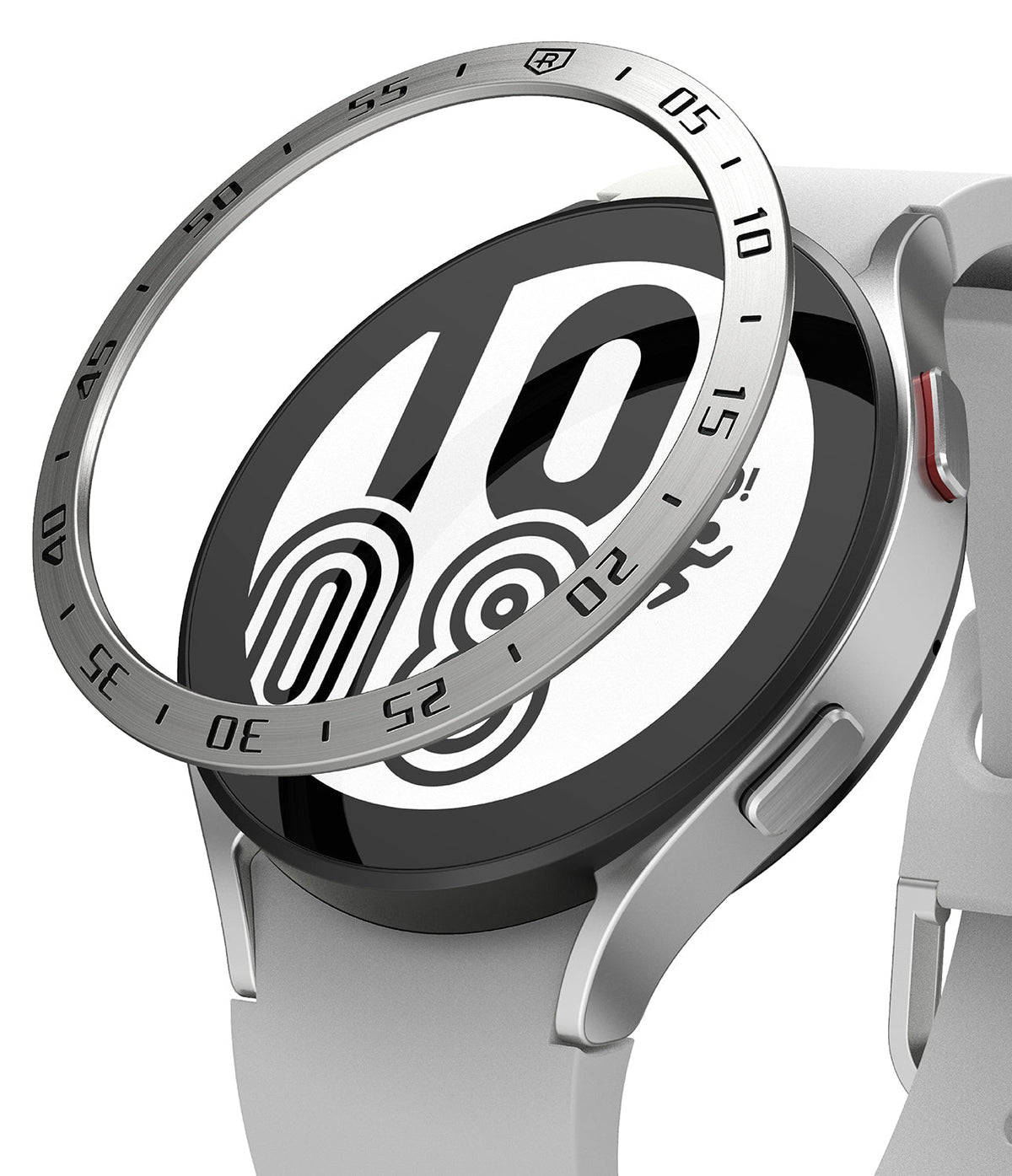 Galaxy Watch 5/4 44mm | Bezel Styling - A silver metal bezel ring hovering above a silver smartwatch with a white strap.