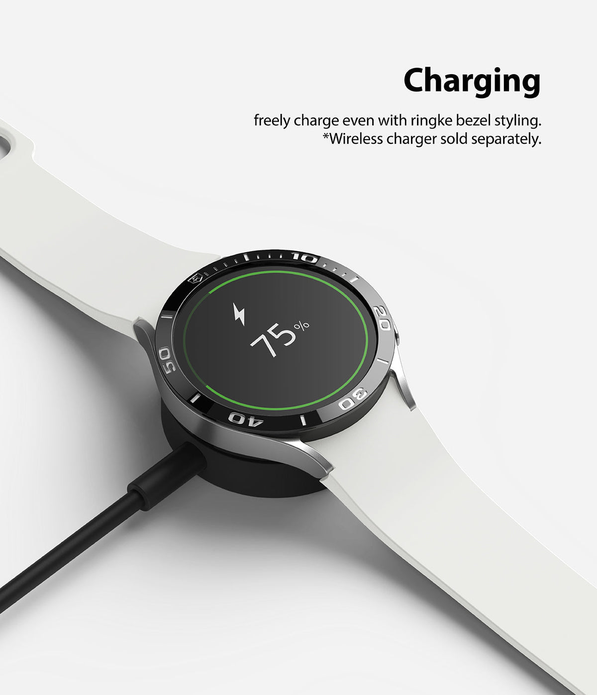 Galaxy Watch 5/4 44mm | Bezel Styling - Smartwatch with black bezel styling charging on a wireless dock at 75%.
