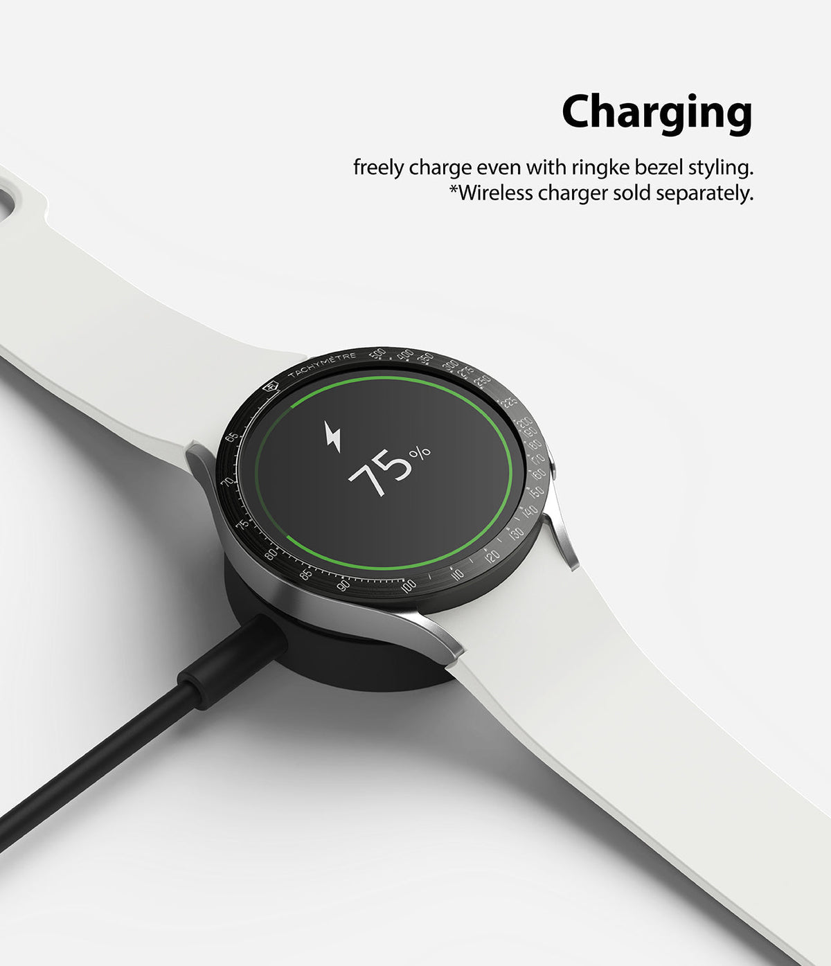 Galaxy Watch 5/4 44mm | Bezel Styling - Smartwatch with black bezel styling charging on a wireless dock at 75 percent.