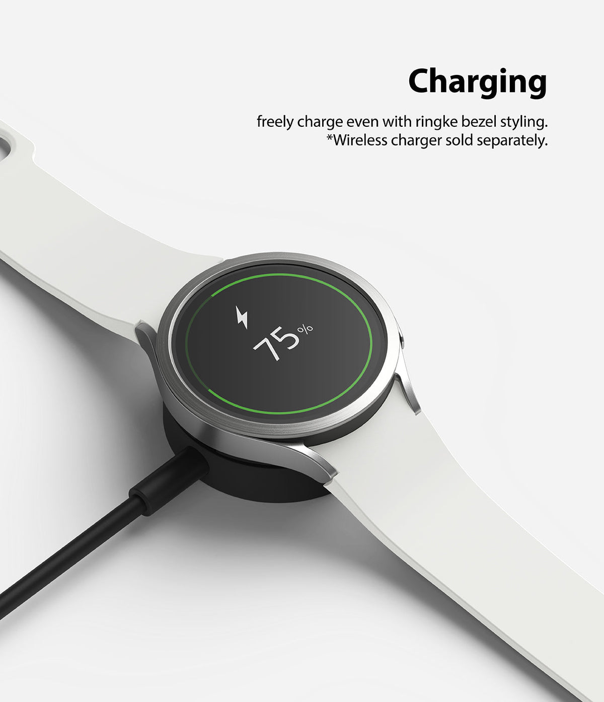 Galaxy Watch 5/4 44mm | Bezel Styling - Smartwatch with silver bezel styling charging on a wireless dock at 75%.