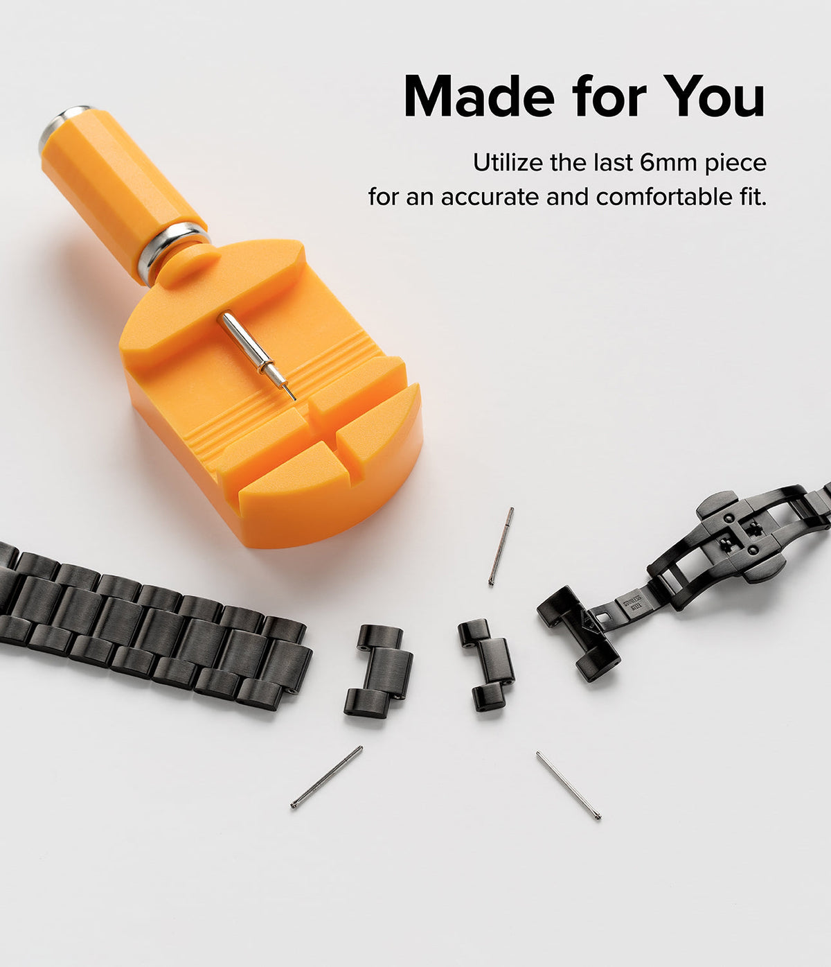 Galaxy Watch 6 / 5 / 4 (44mm) | Metal One Band - Orange watch link removal tool with detached black metal band links.