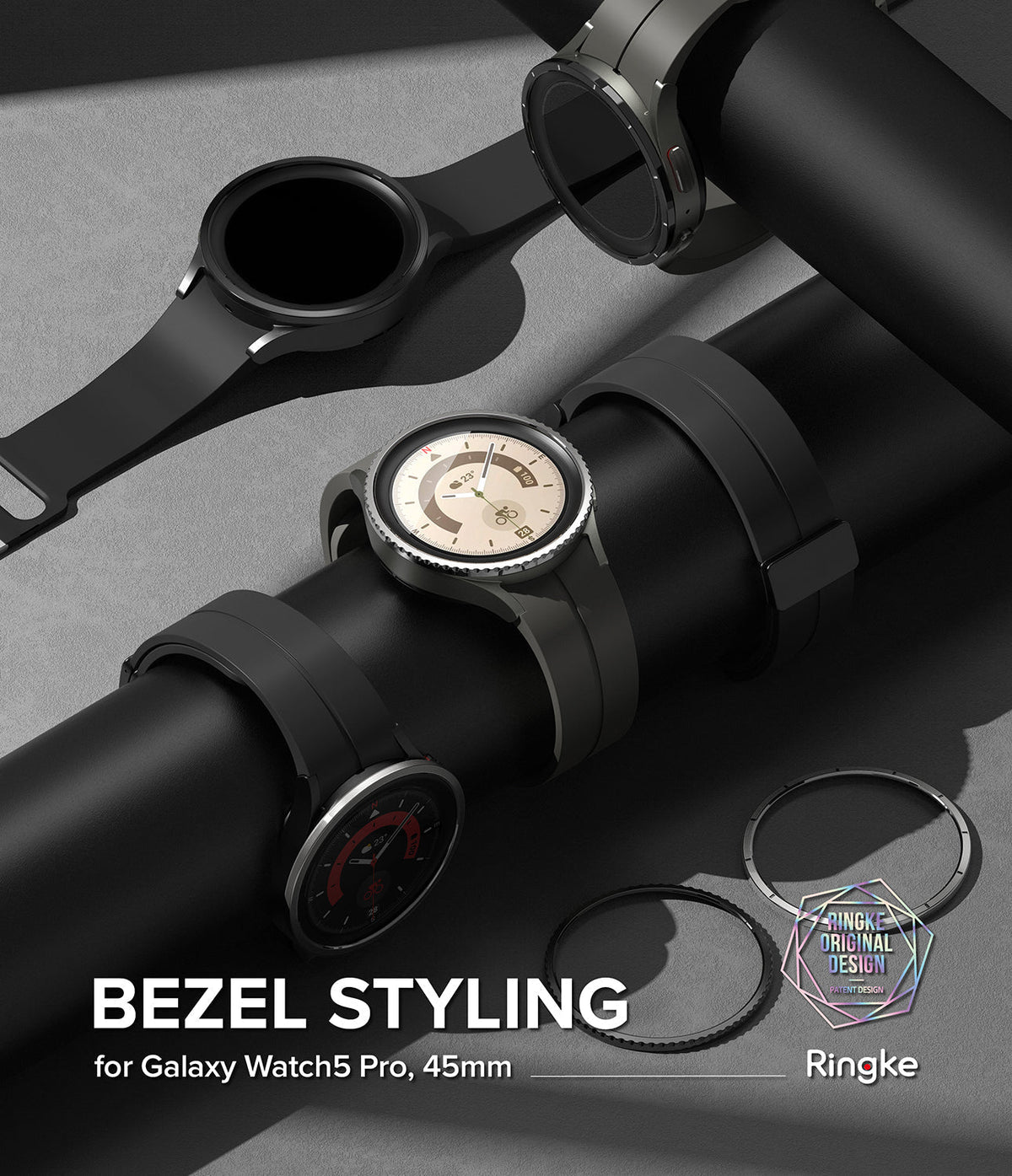 Galaxy Watch 5 Pro 45mm | Bezel Styling - Three Galaxy Watch 5 Pro units on a black stand with two metallic bezel rings.