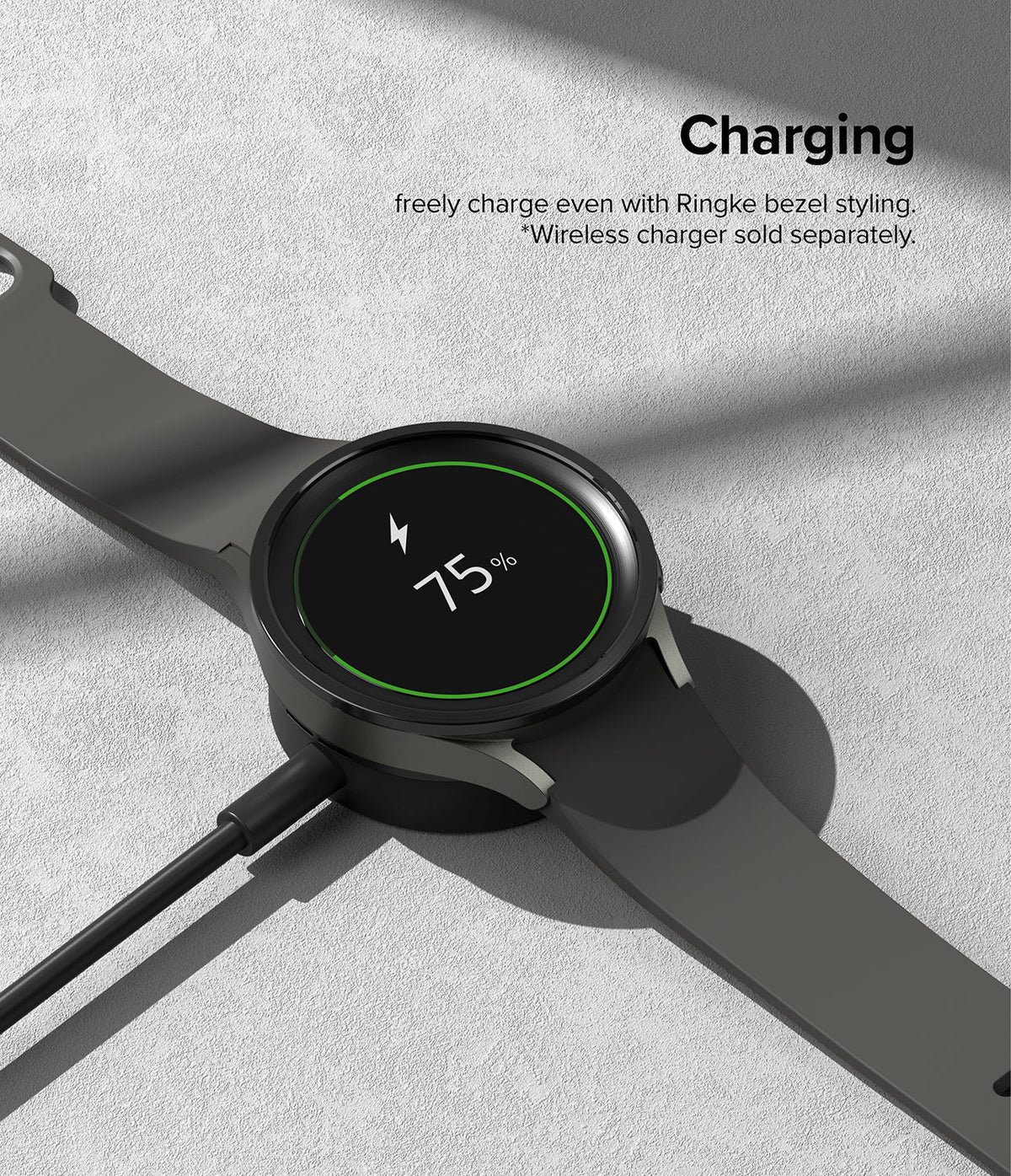 Galaxy Watch 5 Pro 45mm | Bezel Styling - Black smartwatch with bezel styling charging on a wireless dock at 75%.