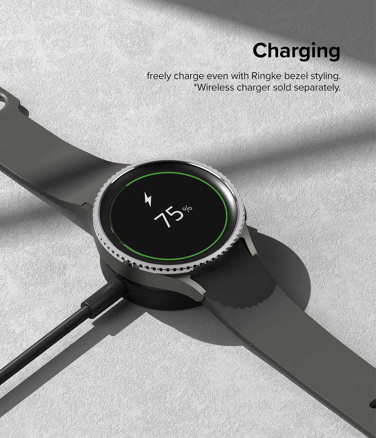 Galaxy Watch 5 Pro 45mm | Bezel Styling - Smartwatch with a metallic bezel ring charging on a wireless dock at 75%.