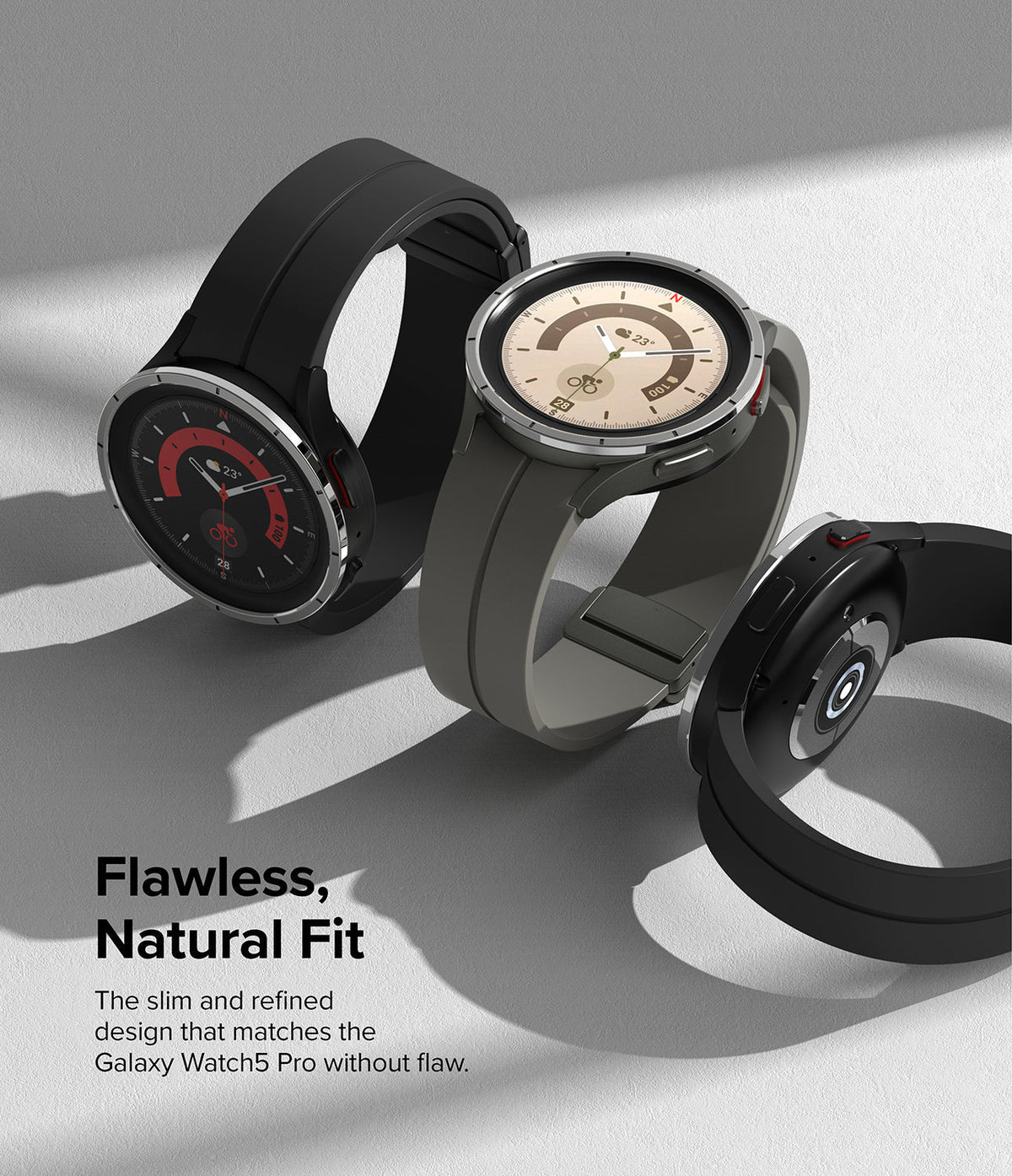 Galaxy Watch 5 Pro 45mm | Bezel Styling - Three Galaxy Watch 5 Pro units with metallic bezel rings on a gray surface.