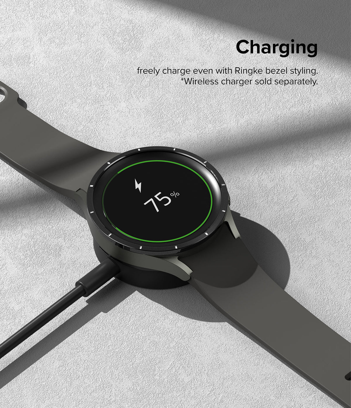 Galaxy Watch 5 Pro 45mm | Bezel Styling - Black smartwatch with bezel styling charging on a wireless dock at 75%.