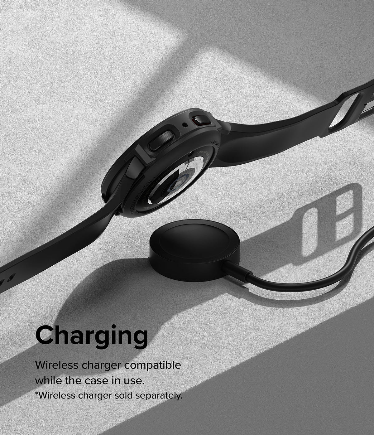 Galaxy Watch 5 Pro Case | Air Sports - Black smartwatch in a protective case hovering above a wireless charging puck.