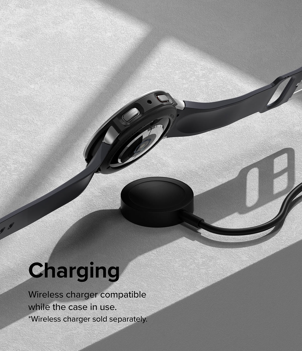 Galaxy Watch 5 40mm | Air Sports Black + Bezel Styling - Galaxy Watch 5 40mm - Black smartwatch with protective bezel styling resting on a wireless charging puck.