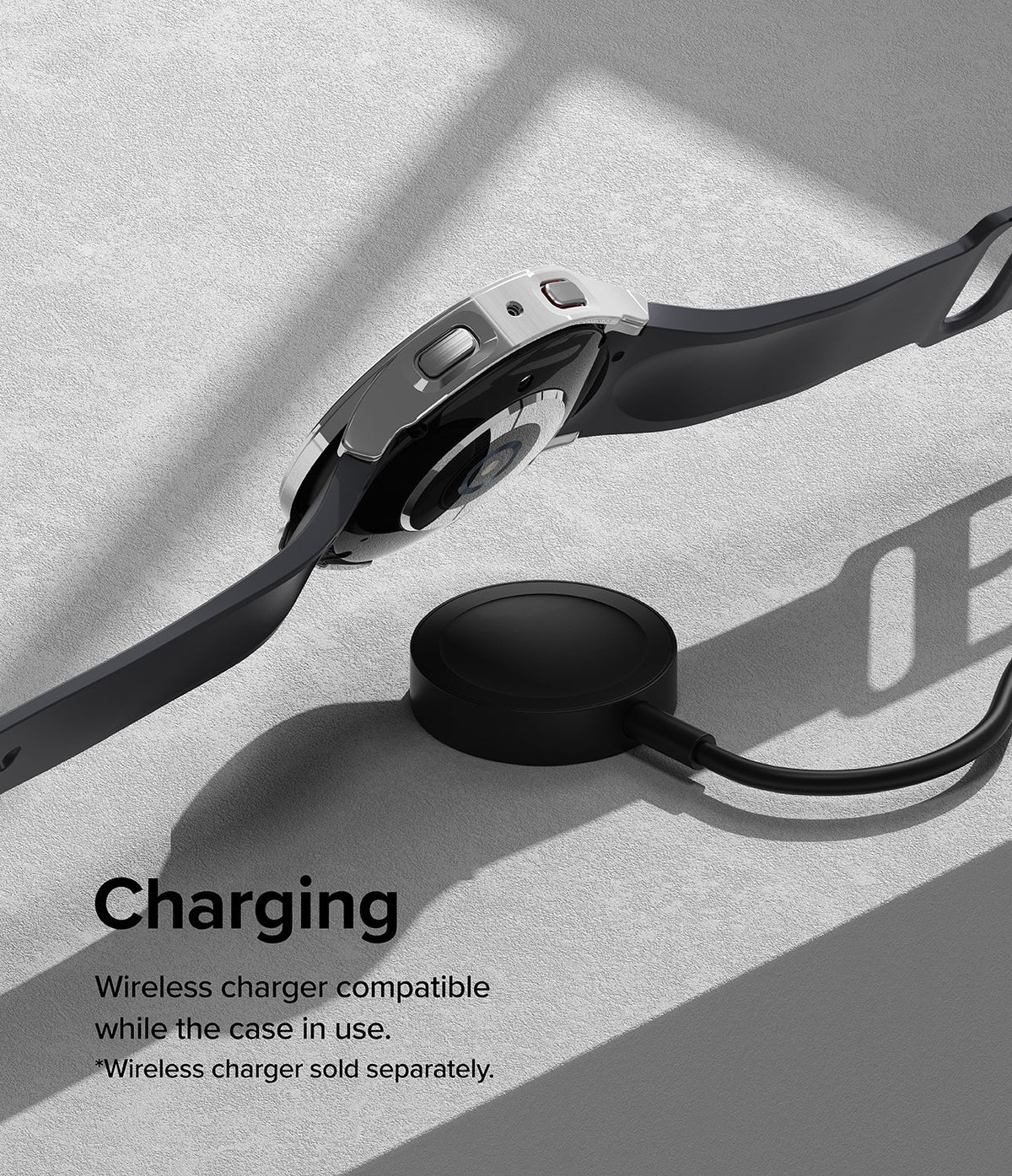 Galaxy Watch 5 44mm Case | Slim - A Galaxy Watch 5 with a slim case hovering above a wireless charging puck on a gray surface.