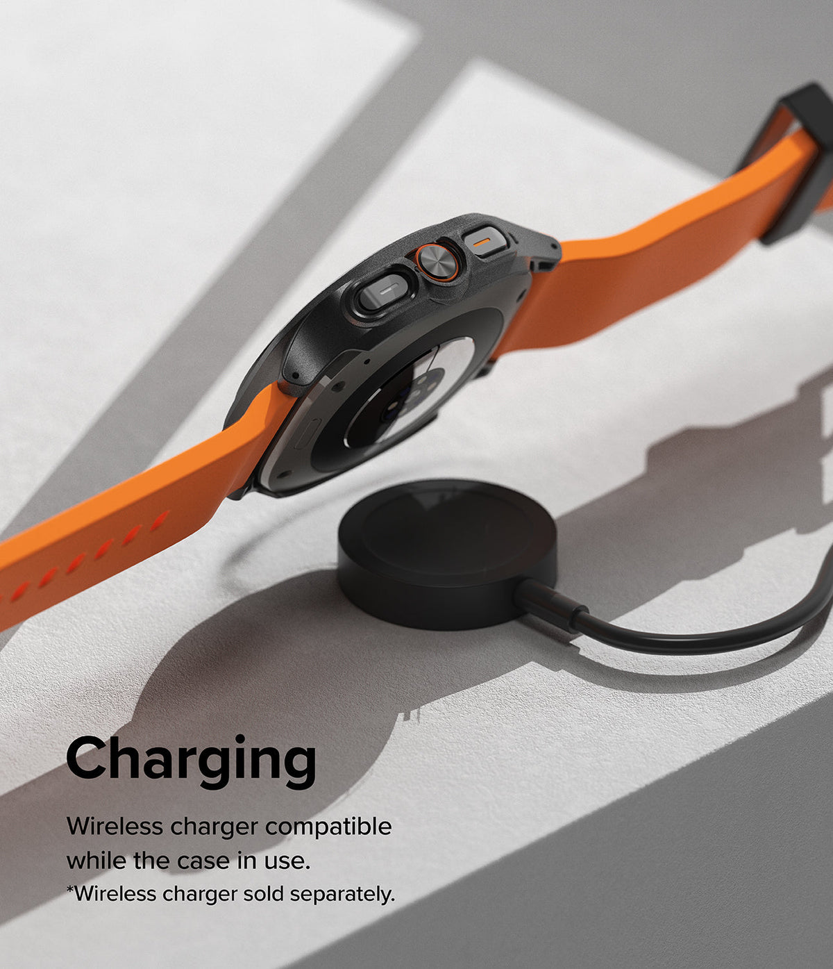 Galaxy Watch Ultra | Slim Extend & Glass - A Galaxy Watch Ultra with an orange band hovering over a wireless charger.