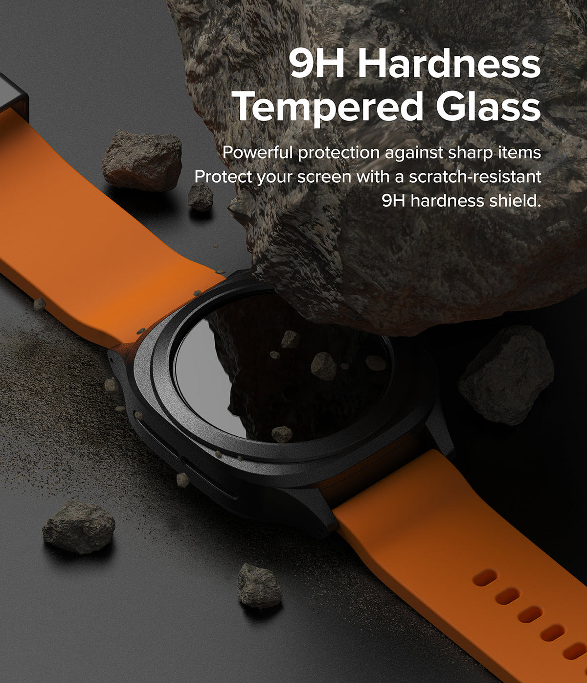 Galaxy Watch Ultra | Slim Extend & Glass - A smartwatch with an orange band sits under a jagged rock, highlighting 9H tempered glass protection.
