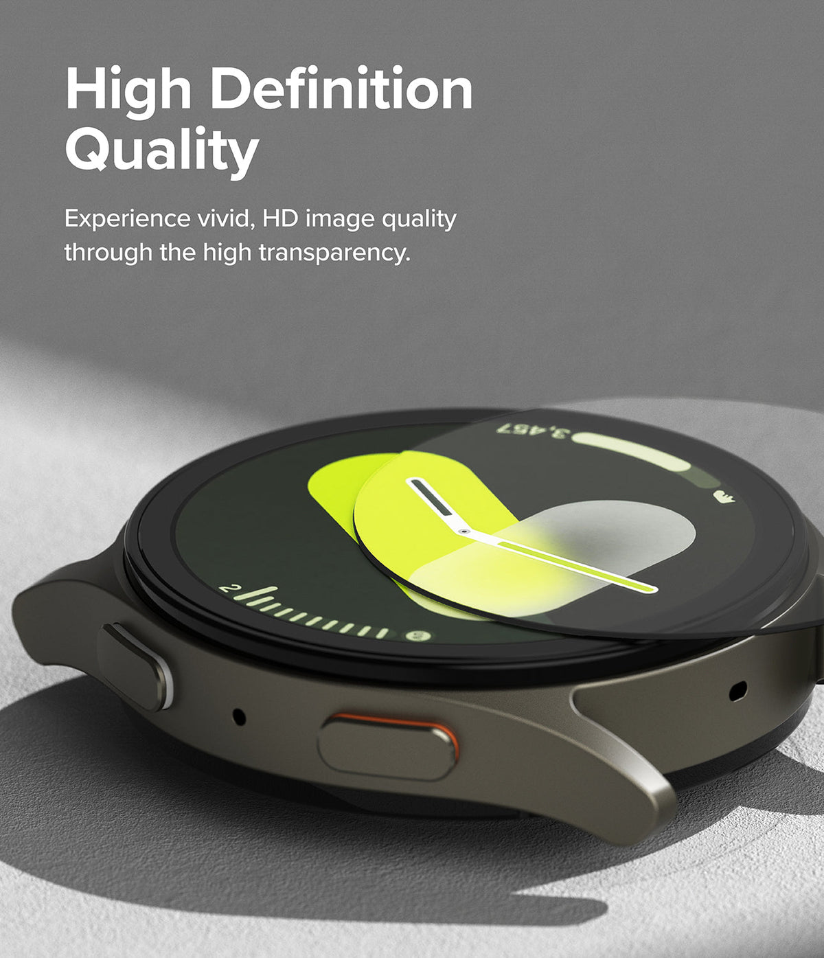 Galaxy Watch 7 (40mm) | Bezel Styling & Glass - A screen protector being applied to a Galaxy Watch 7 with a green watch face.