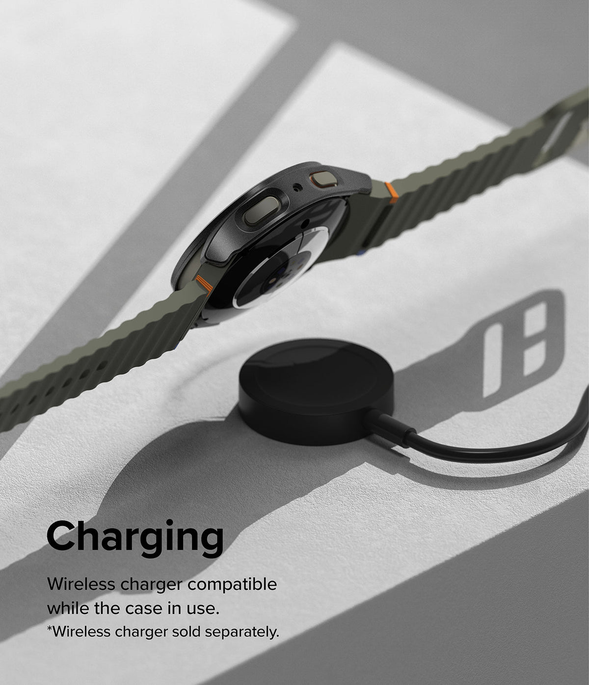 Galaxy Watch 7 (44mm) | Slim & Glass - A Galaxy Watch 7 with an olive green band hovering above a wireless charging puck.