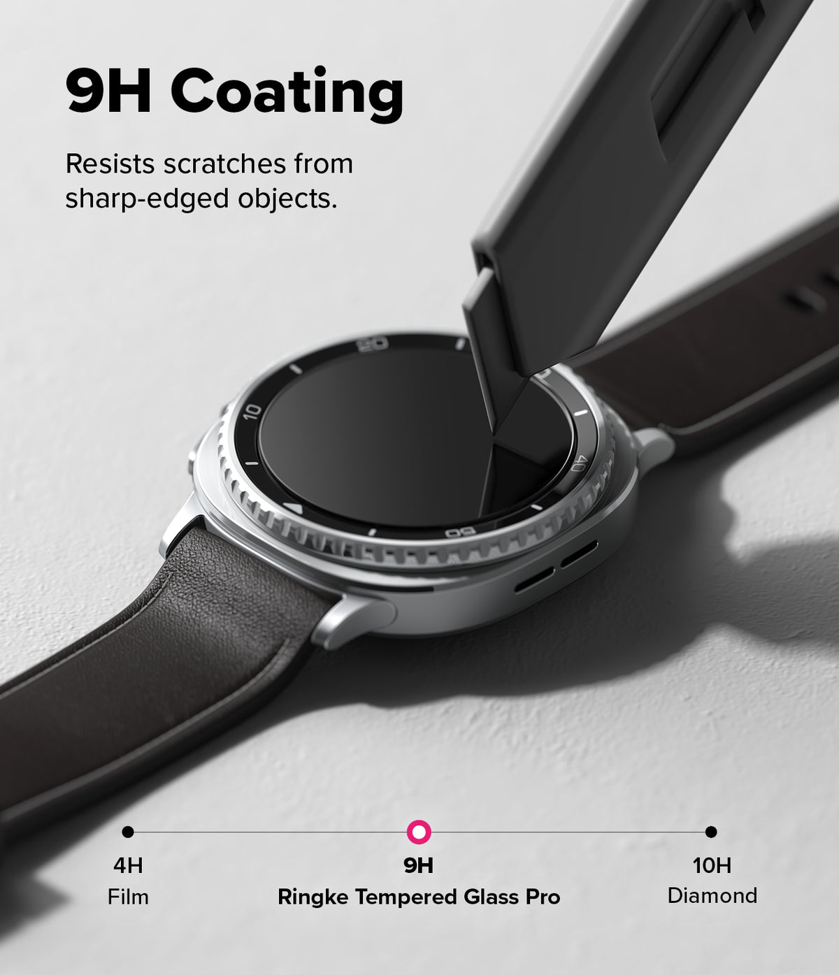 Galaxy Watch 8 Classic 46mm Screen Protector | Tempered Glass Pro - A utility knife blade touches a smartwatch screen to show 9H scratch resistance.