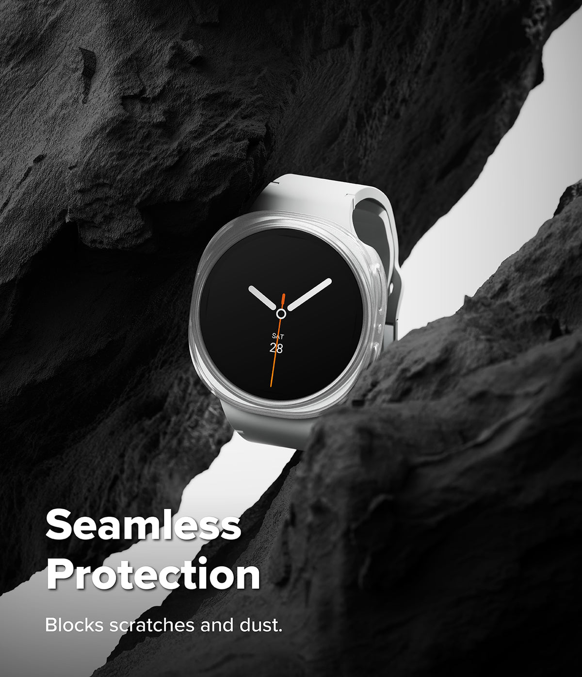 Galaxy Watch 8 40mm Case | Slim - A white smartwatch with a black round face is shown nestled between dark rock formations. White text at the bottom reads 'Seamless Protection' and 'Blocks scratches and dust.