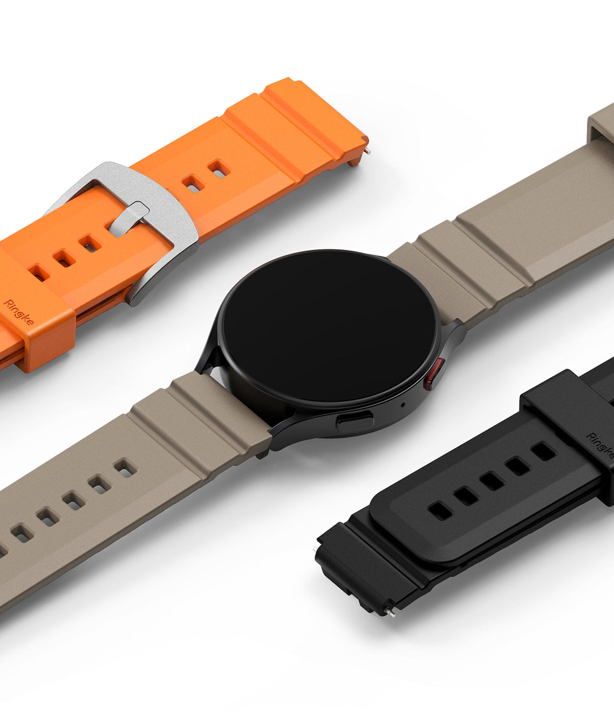 Watch Lug 20mm | Rubber One Bold Band - A smartwatch with a beige band, surrounded by orange and black rubber bands.