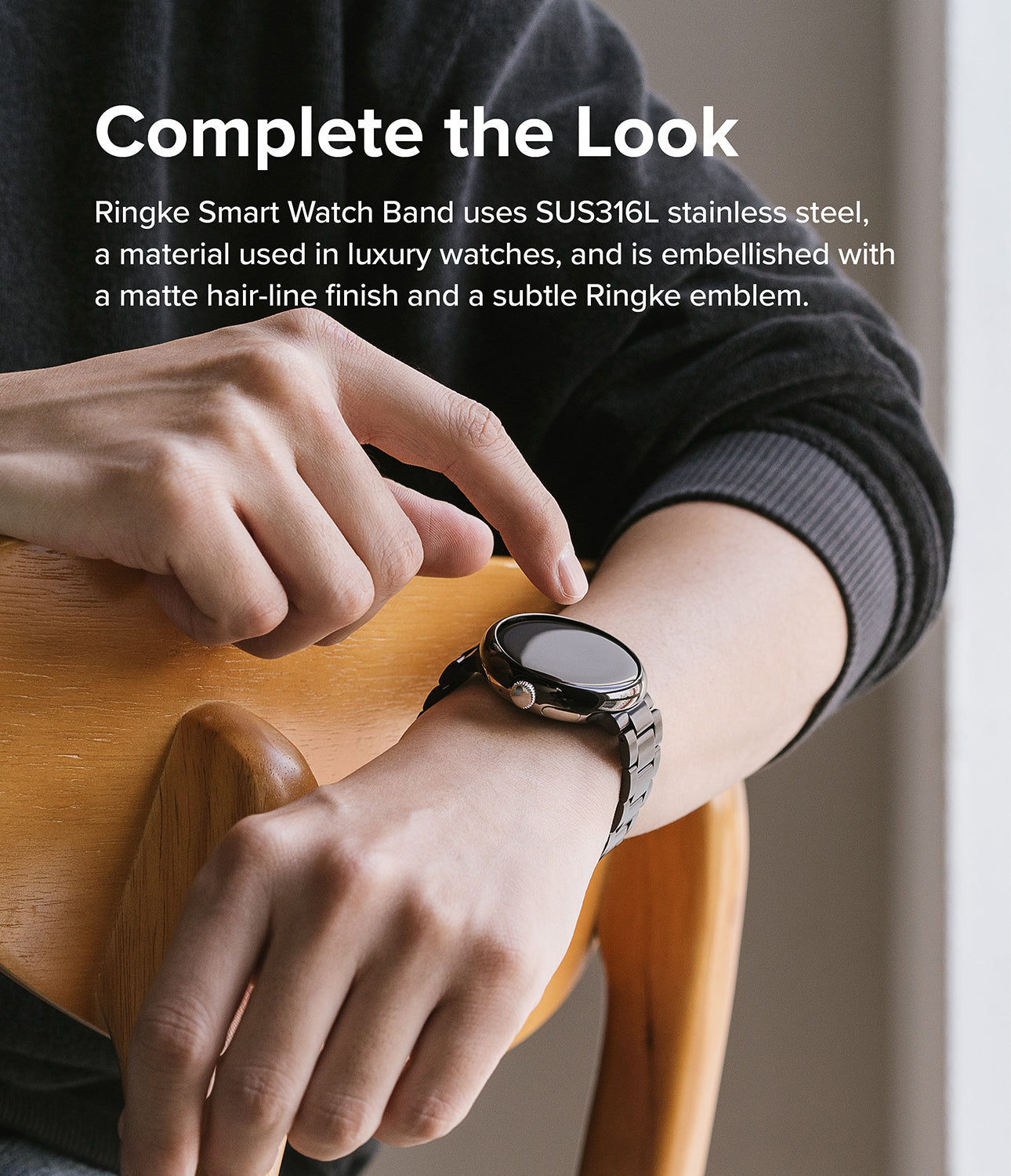 Google Pixel Watch | Metal One Band - Person wearing a black stainless steel link band on a Google Pixel Watch.