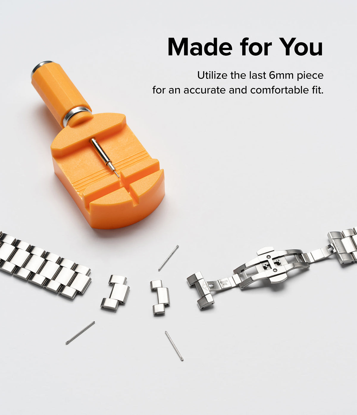 Google Pixel Watch | Metal One Band - Orange watch link removal tool with detached metal band links and pins.