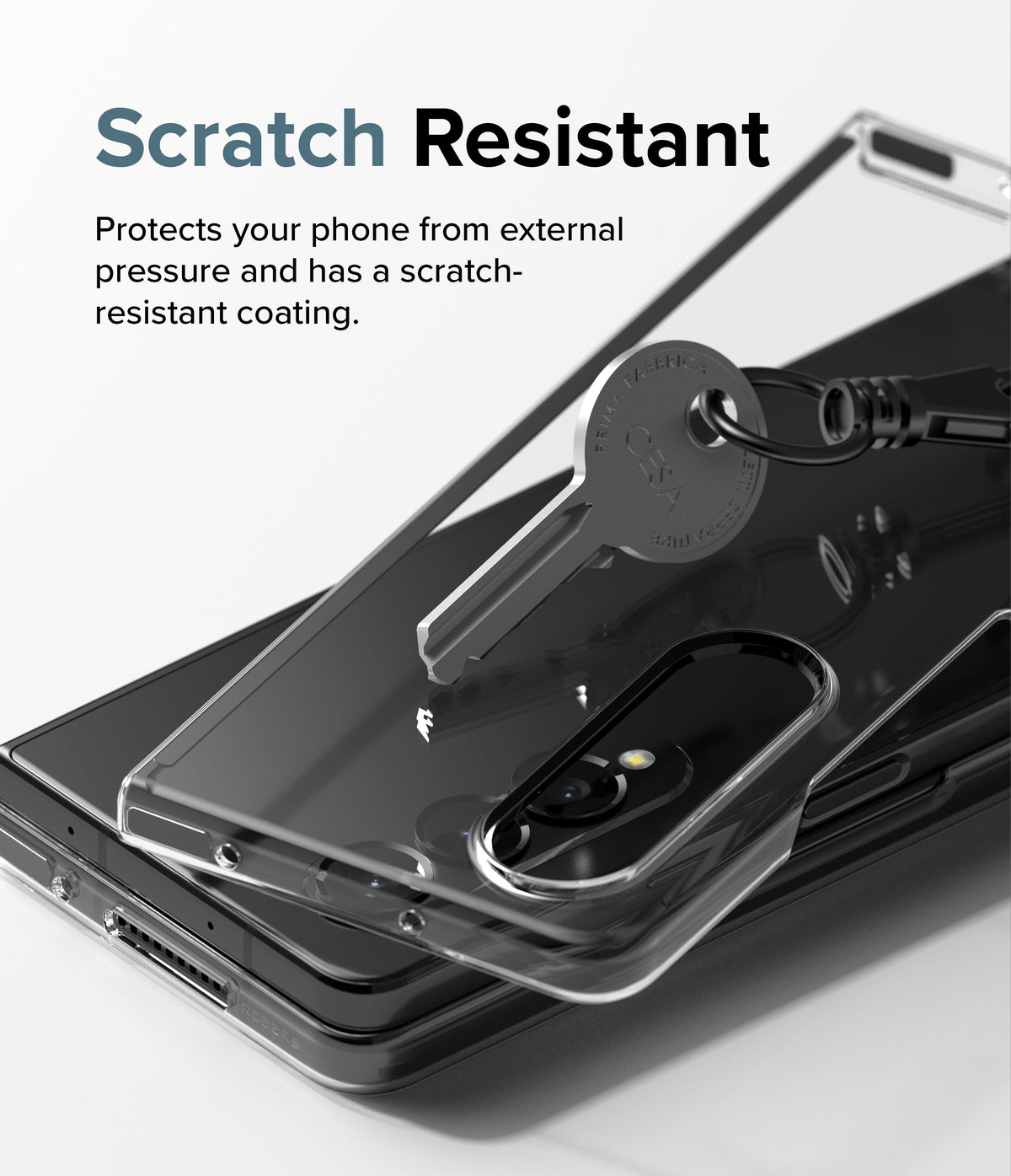 Galaxy Z Fold 4 Case | Slim - A metal key resting on a clear phone case covering a black Galaxy Z Fold 4.