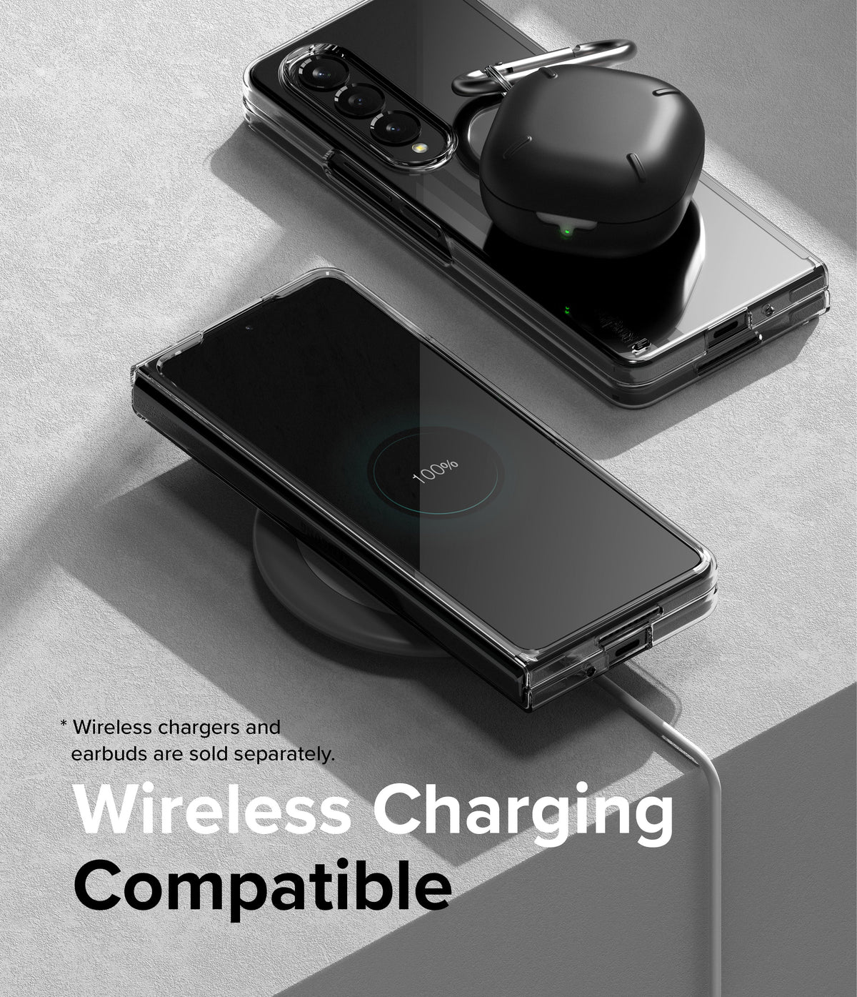 Galaxy Z Fold 4 Case | Slim - A clear phone case on a Galaxy Z Fold 4 charging wirelessly with earbuds on top.