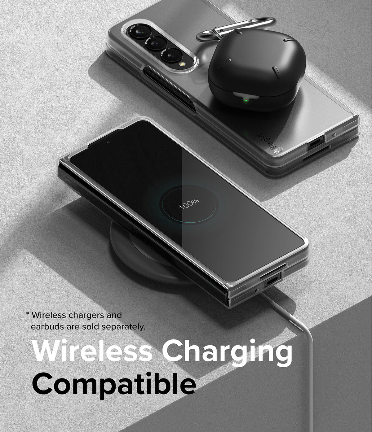 Galaxy Z Fold 4 Case | Slim - Folded phone in clear case on wireless charger with earbuds case on top, showing 100% charge.