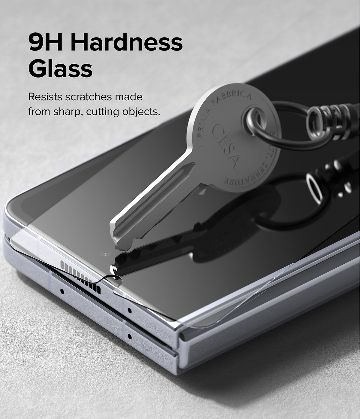 Galaxy Z Fold 5 Screen Protector | Cover Display Glass - Galaxy Z Fold 5 Screen Protector - A metal key pressing against a phone screen protector to demonstrate scratch resistance.