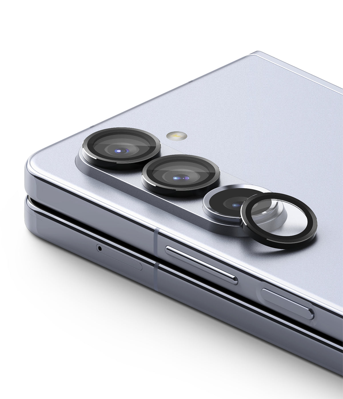 Galaxy Z Fold 5 | Camera Lens Frame Glass - Galaxy Z Fold 5 - Black protective glass rings installed over the camera lenses of a silver foldable smartphone.