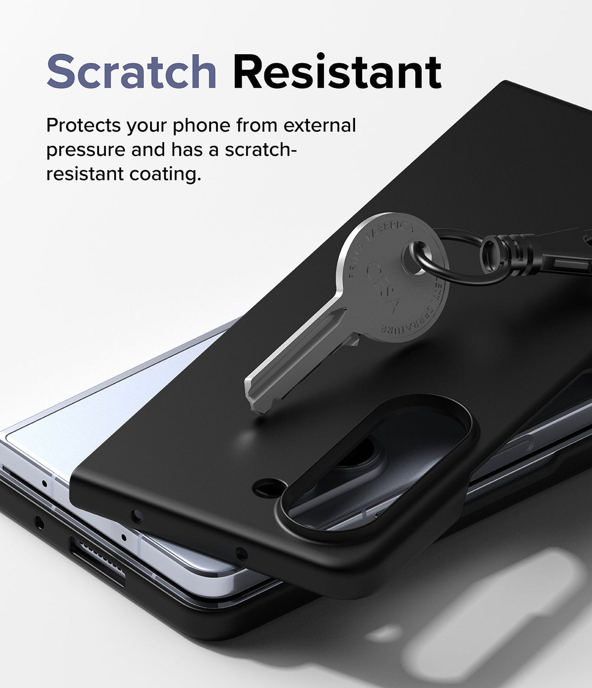 Galaxy Z Fold 5 Case | Slim - A metal key rests on a black phone case, demonstrating its scratch-resistant surface.