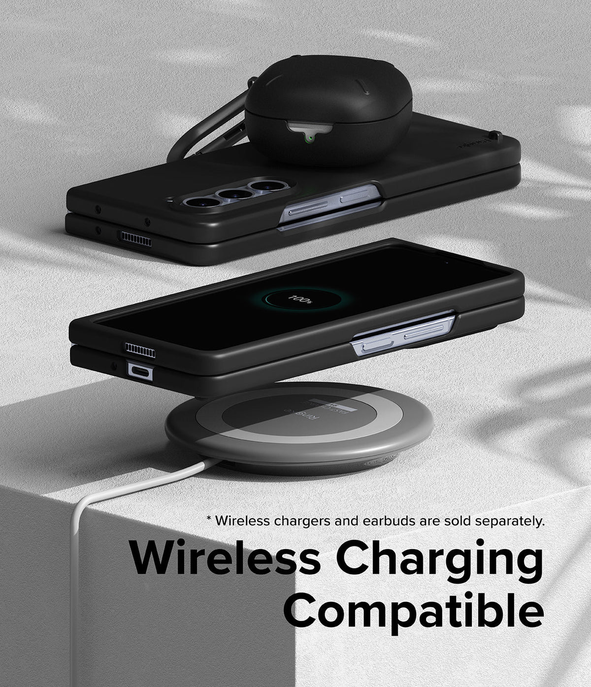 Galaxy Z Fold 5 Case | Slim - Folded phone in black case charging wirelessly on a pad with earbuds case on top.