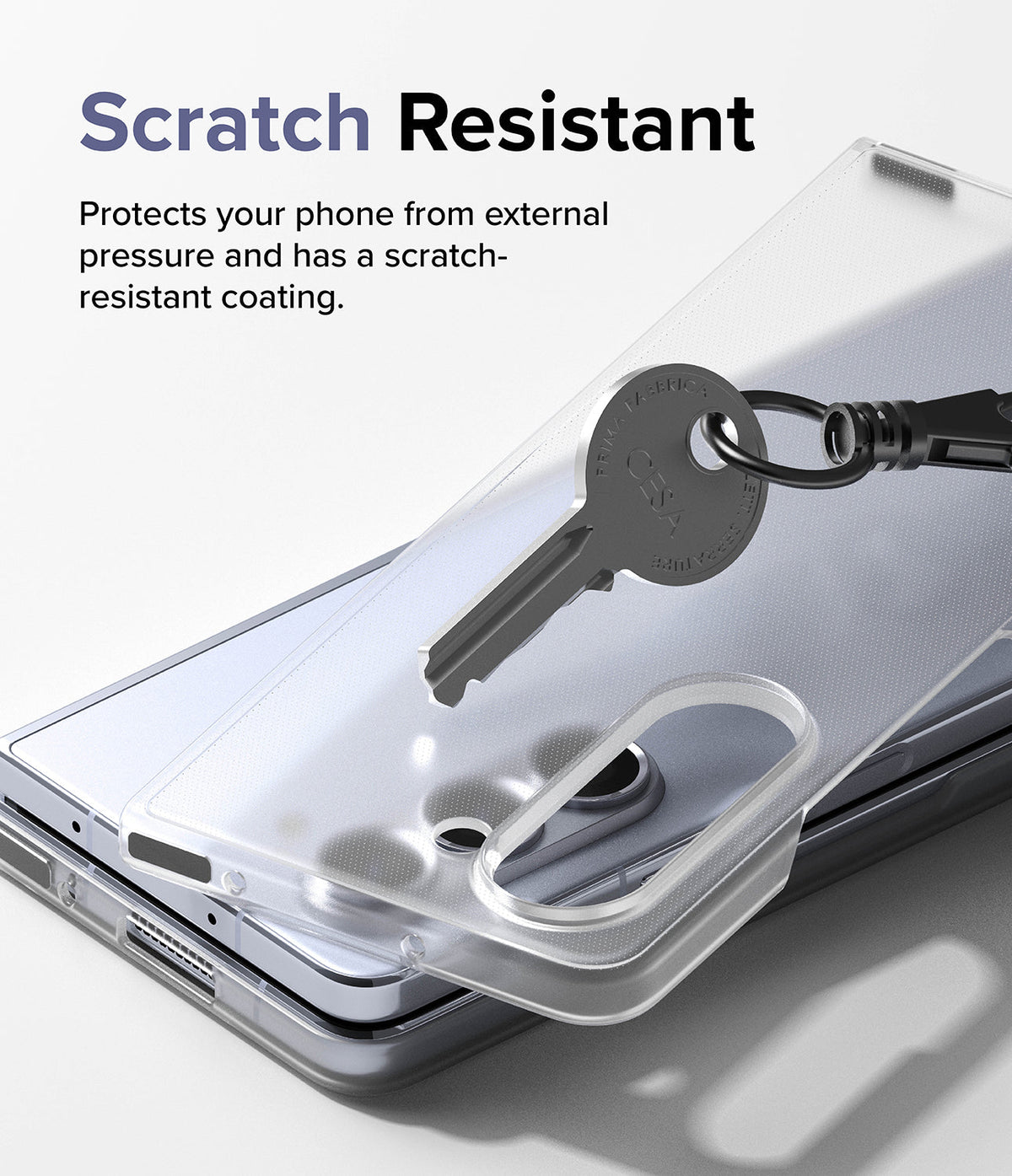 Galaxy Z Fold 5 Case | Slim - A key scratches a clear phone case resting on a Galaxy Z Fold 5 to demonstrate scratch resistance.