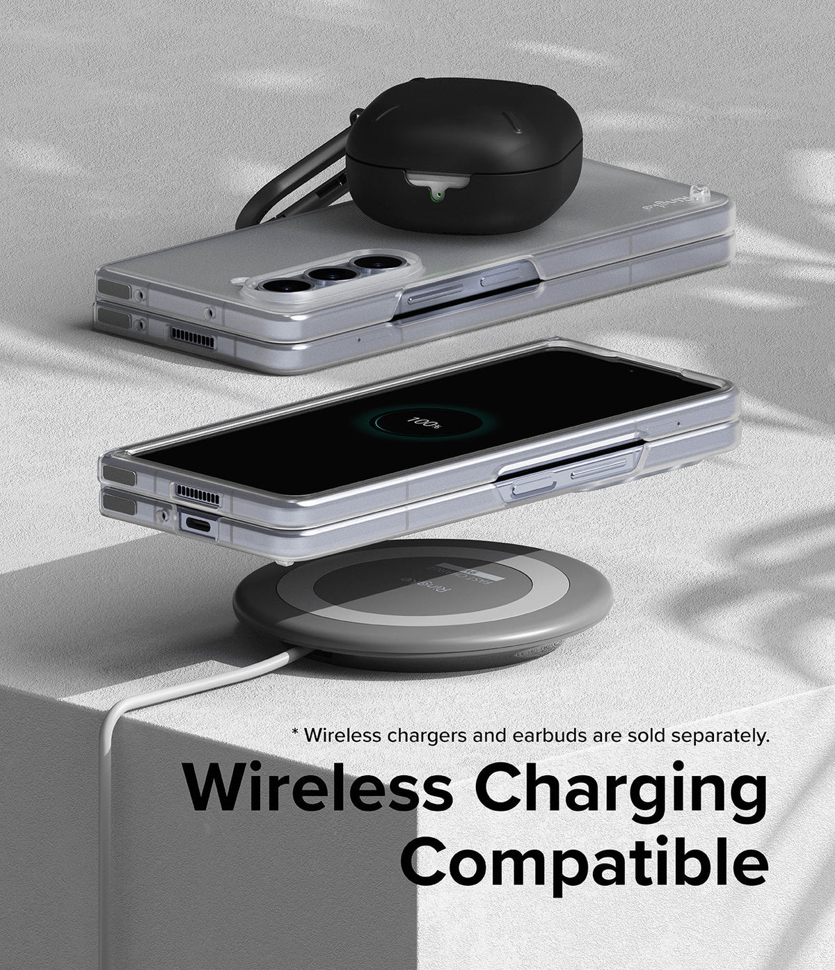 Galaxy Z Fold 5 Case | Slim - Folded phone in clear case wirelessly charging on a pad with earbuds case on top.