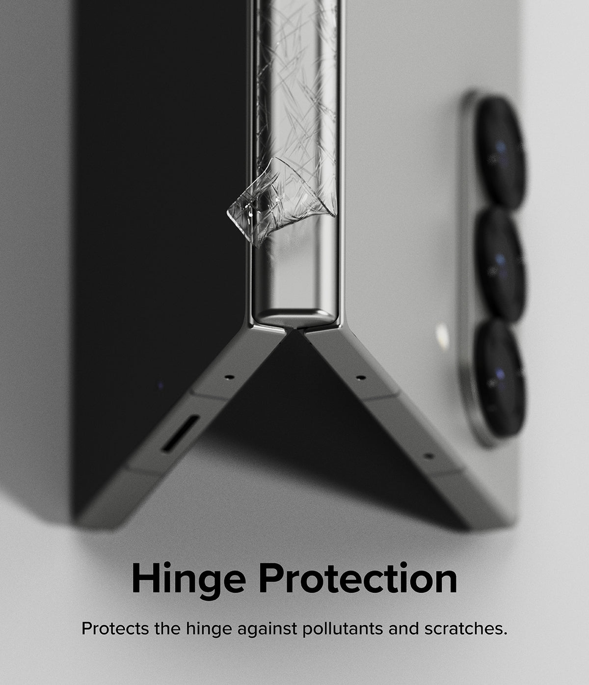 Galaxy Z Fold 6 | 3-in-1 Protector - A clear protective film being applied to the hinge of a folded silver smartphone.