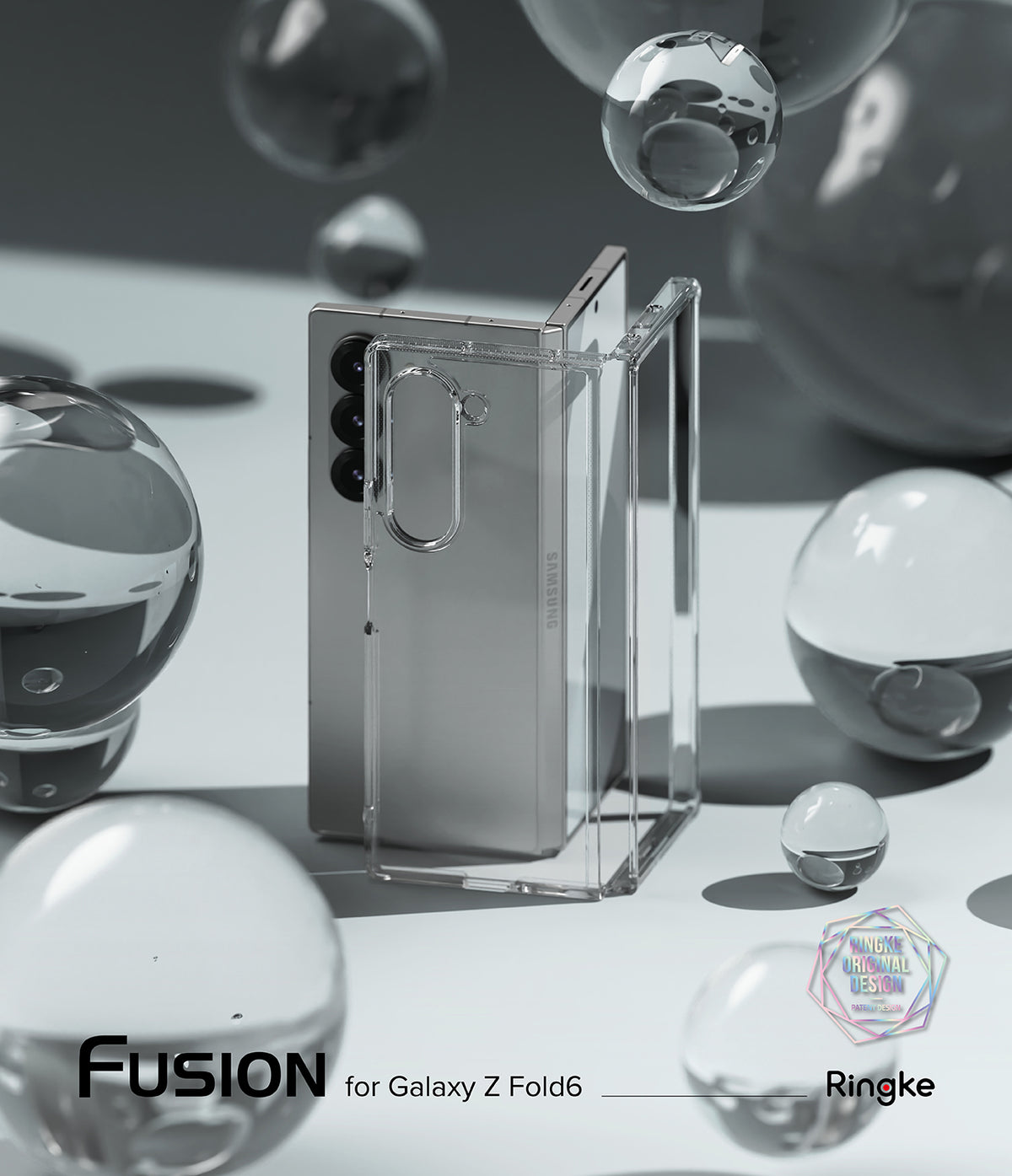 Galaxy Z Fold 6 Case | Fusion - Clear - Clear protective case standing next to a silver Galaxy Z Fold 6 amid glass spheres.