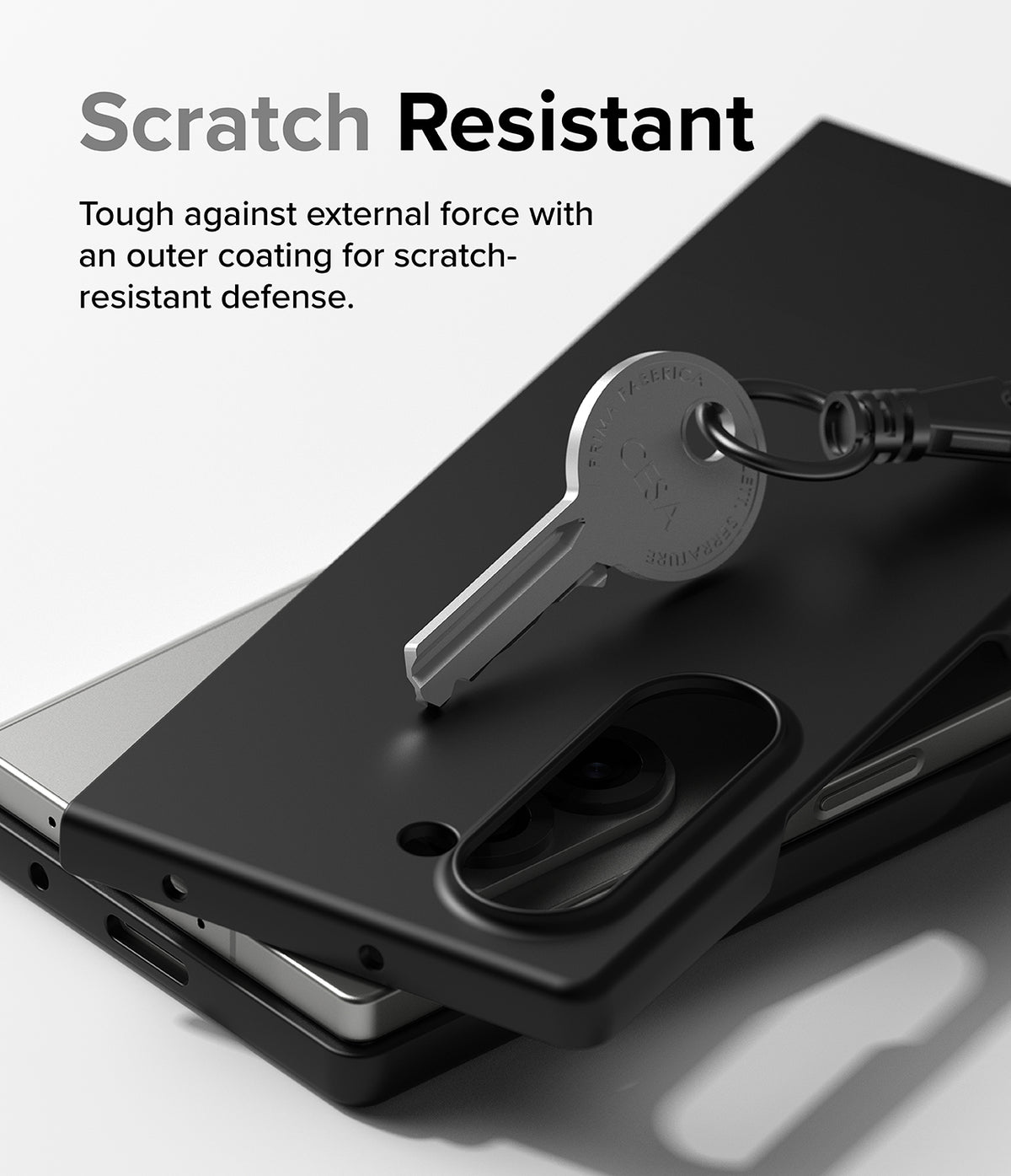 Galaxy Z Fold 6 Case | Slim - A metal key rests on a matte black phone case, demonstrating scratch-resistant protection.