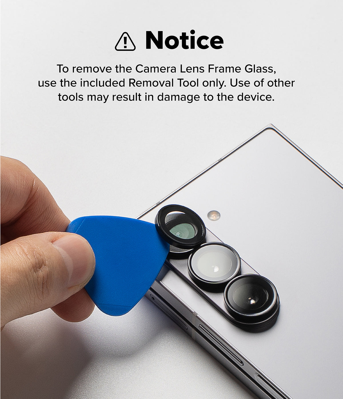 Galaxy Z Fold 7 | Camera Lens Frame Glass (2 Pack) - A hand uses a blue plastic tool to carefully remove a camera lens protector from a smartphone.