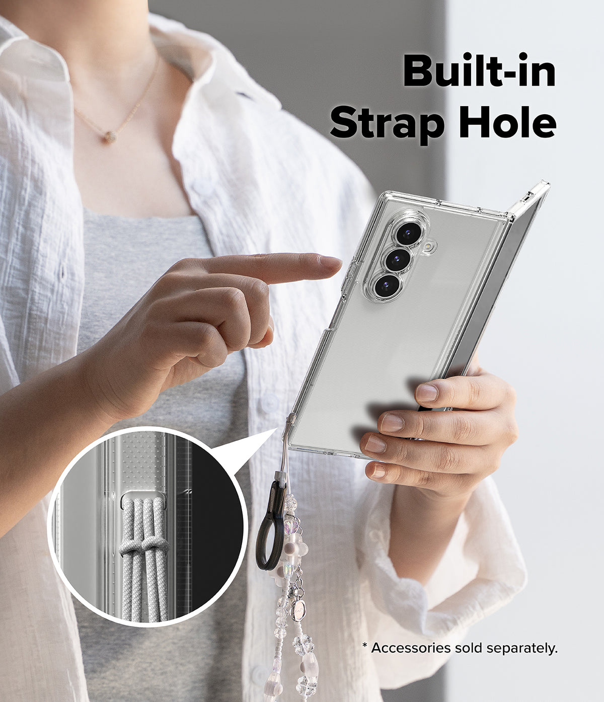 Galaxy Z Fold 7 Case | Fusion - Person holding a clear phone case with a close-up inset showing the built-in strap hole.